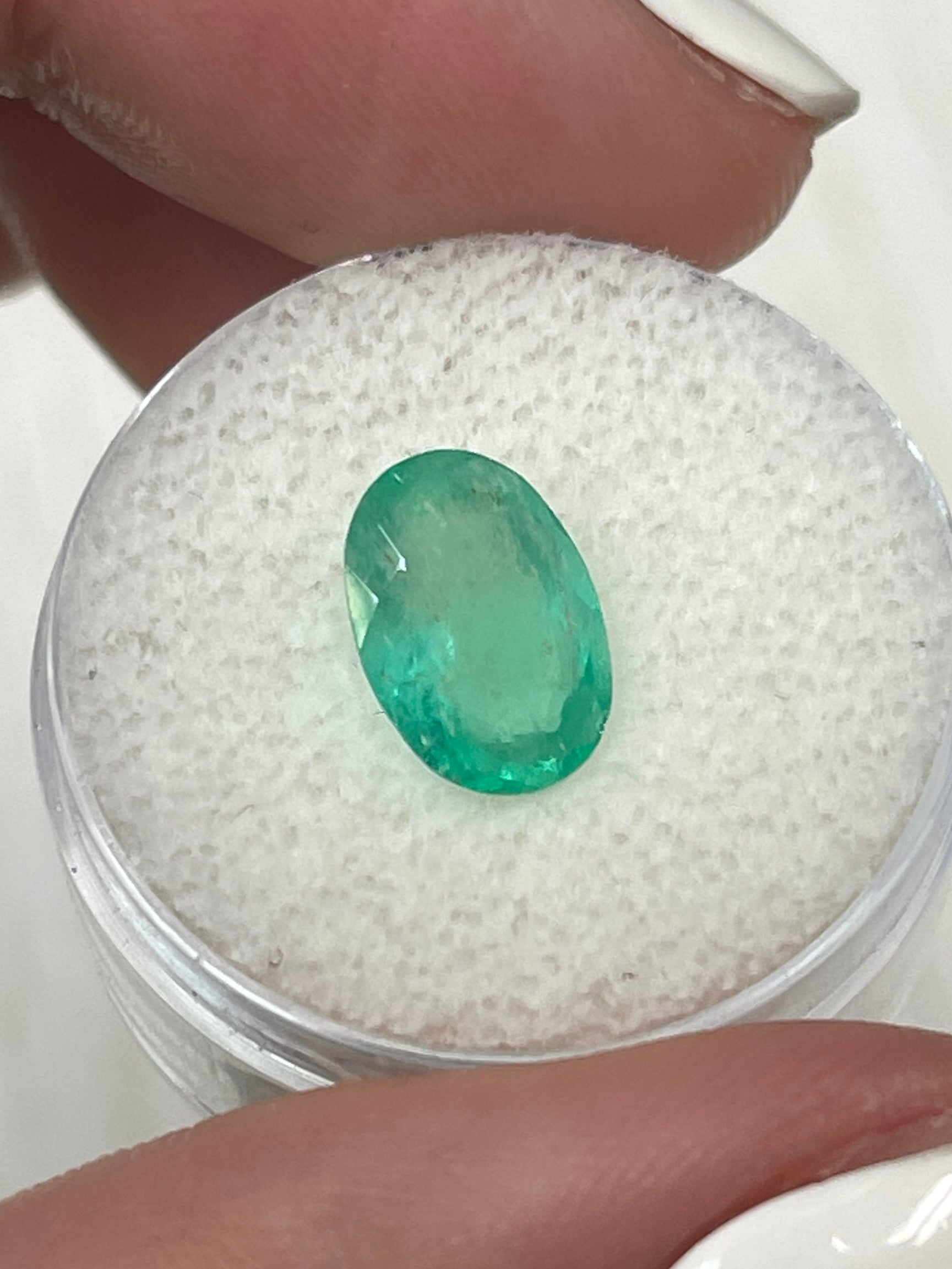 2.40 Carat slender medium light green Colombian emerald loose oval cut gemstone from JR Colombian Emeralds.