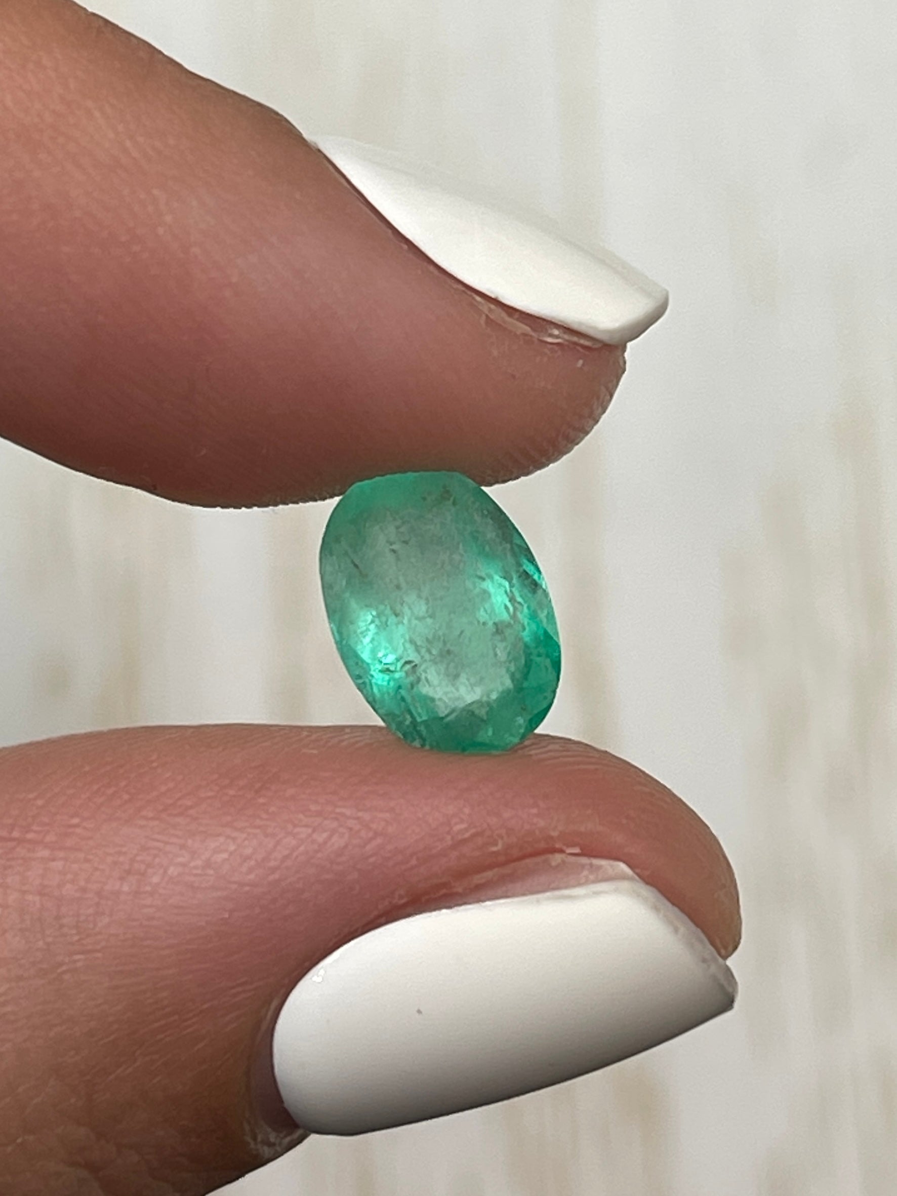 2.40 Carat slender medium light green Colombian emerald in oval cut, loose gemstone from JR Colombian Emeralds.