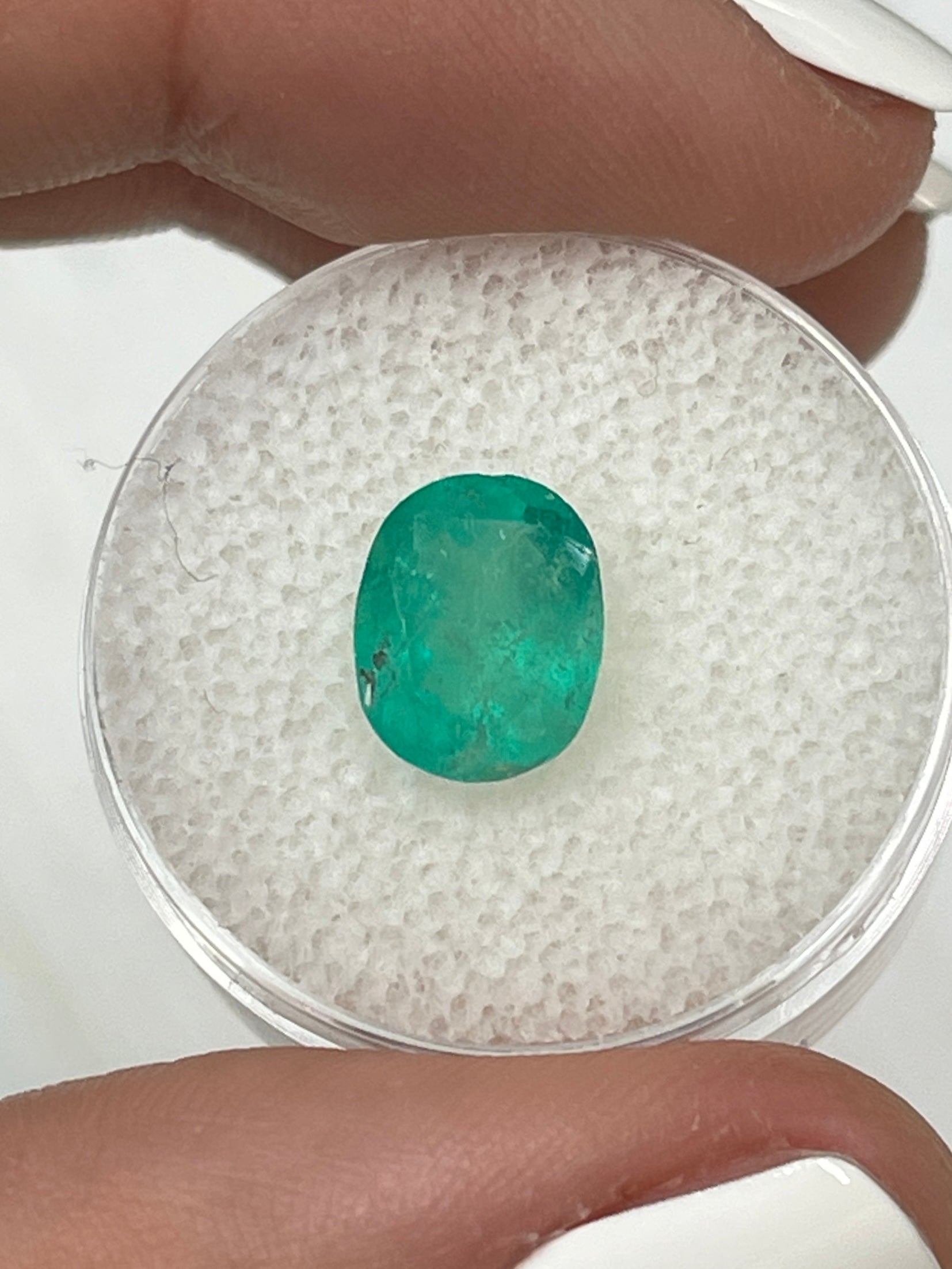 Oval-cut 2.48 carat medium green Colombian emerald, loose gemstone with natural clarity, from JR Colombian Emeralds.
