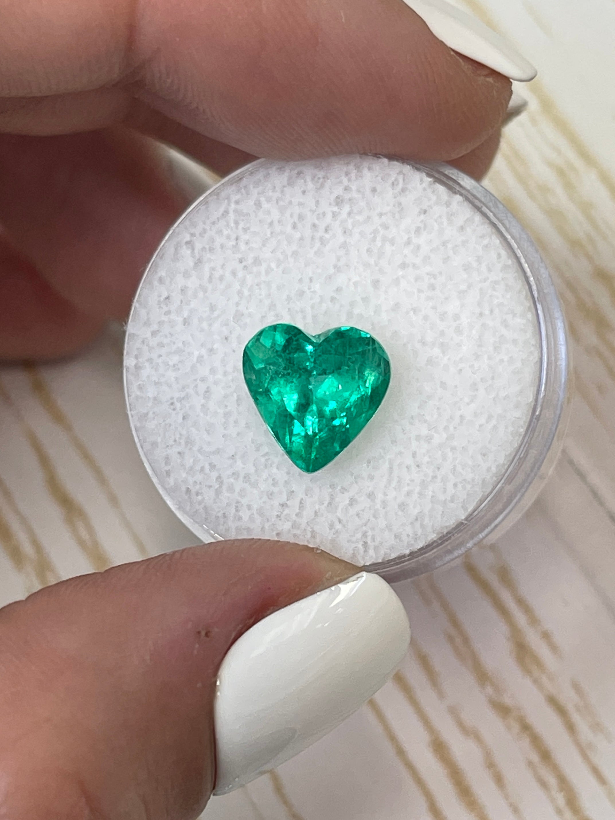 2.52 carat bluish-green natural Colombian emerald loose gemstone with heart cut, showcased by JR Colombian Emeralds.