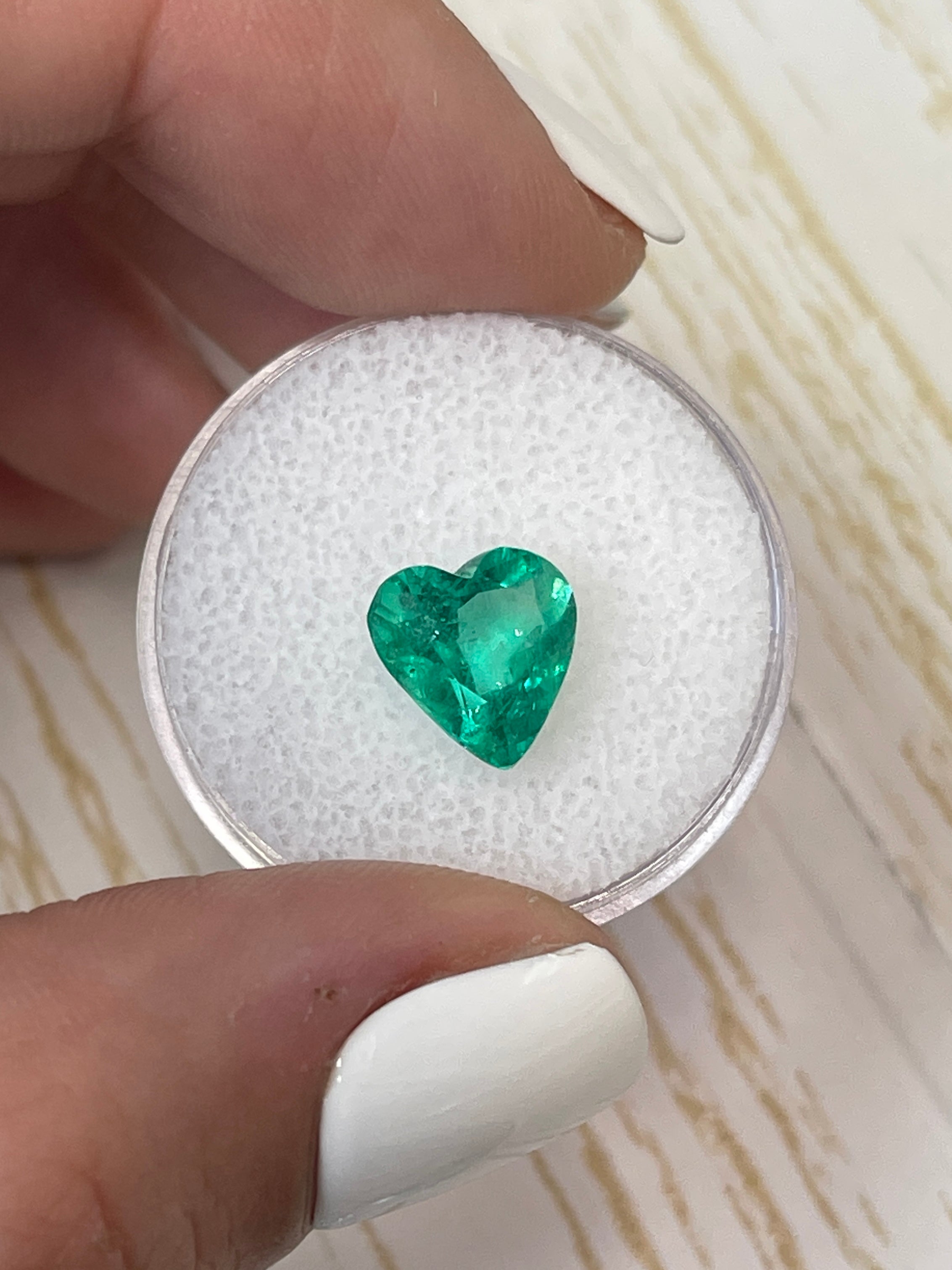 2.52 Carat bluish green natural Colombian emerald loose heart cut gemstone, showcasing vibrant color and clarity.