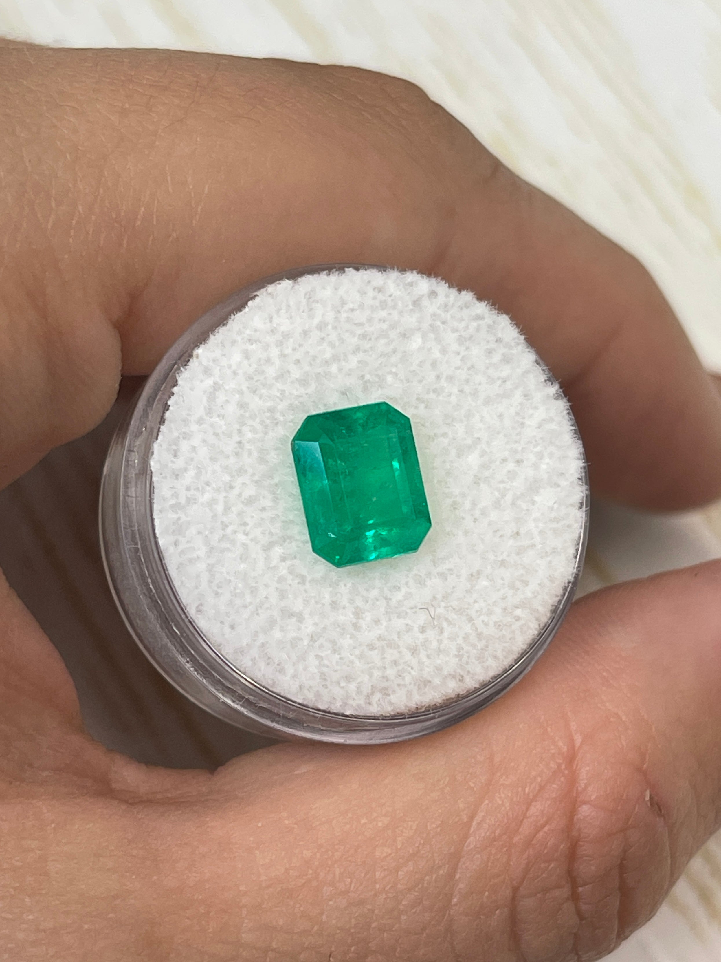 2.52 carat intense green natural Colombian emerald loose gemstone in an emerald cut, showcasing rich color and clarity.