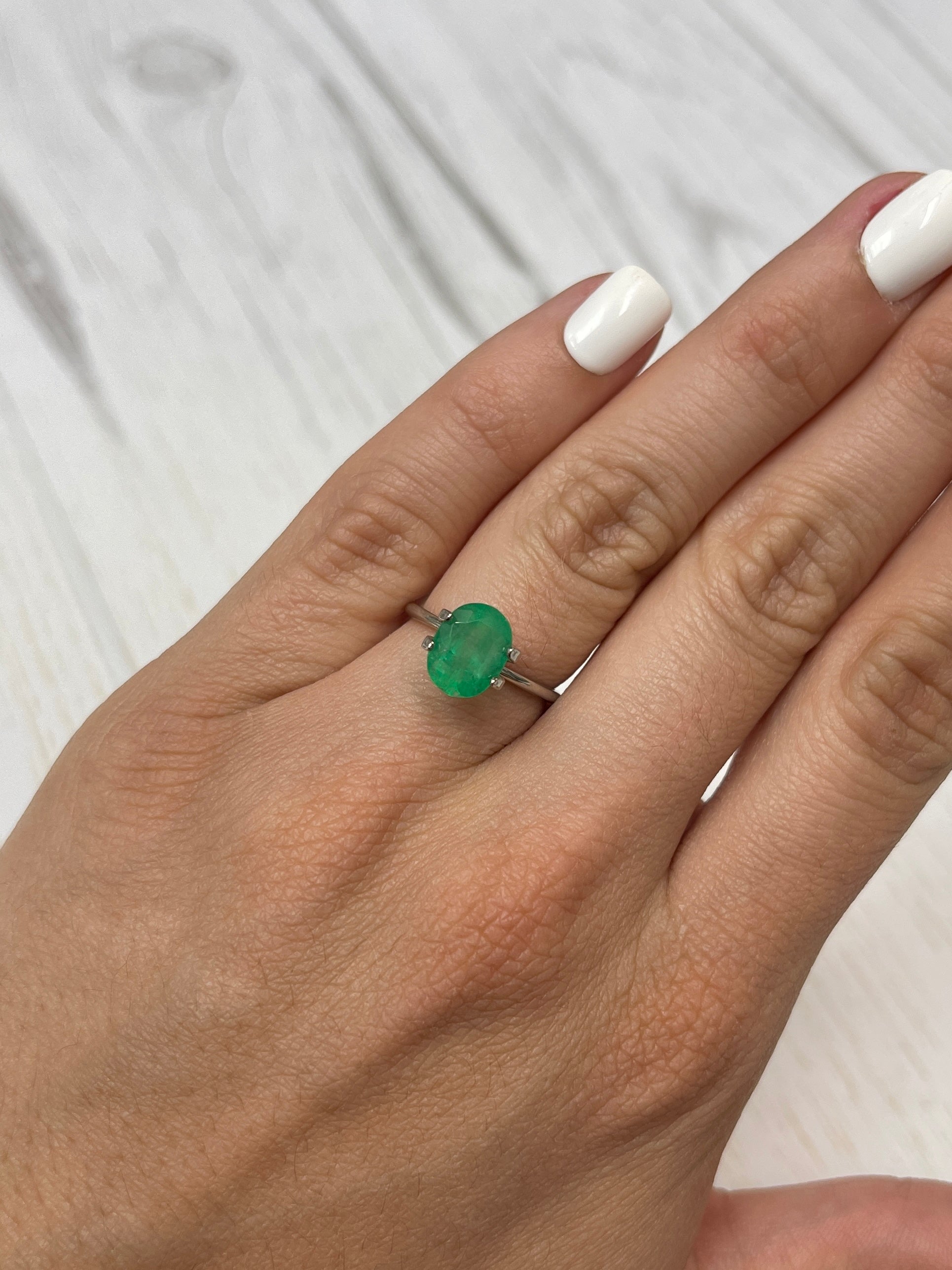 2.52 carat mossy yellowish green natural loose Colombian emerald in oval cut, from JR Colombian Emeralds.