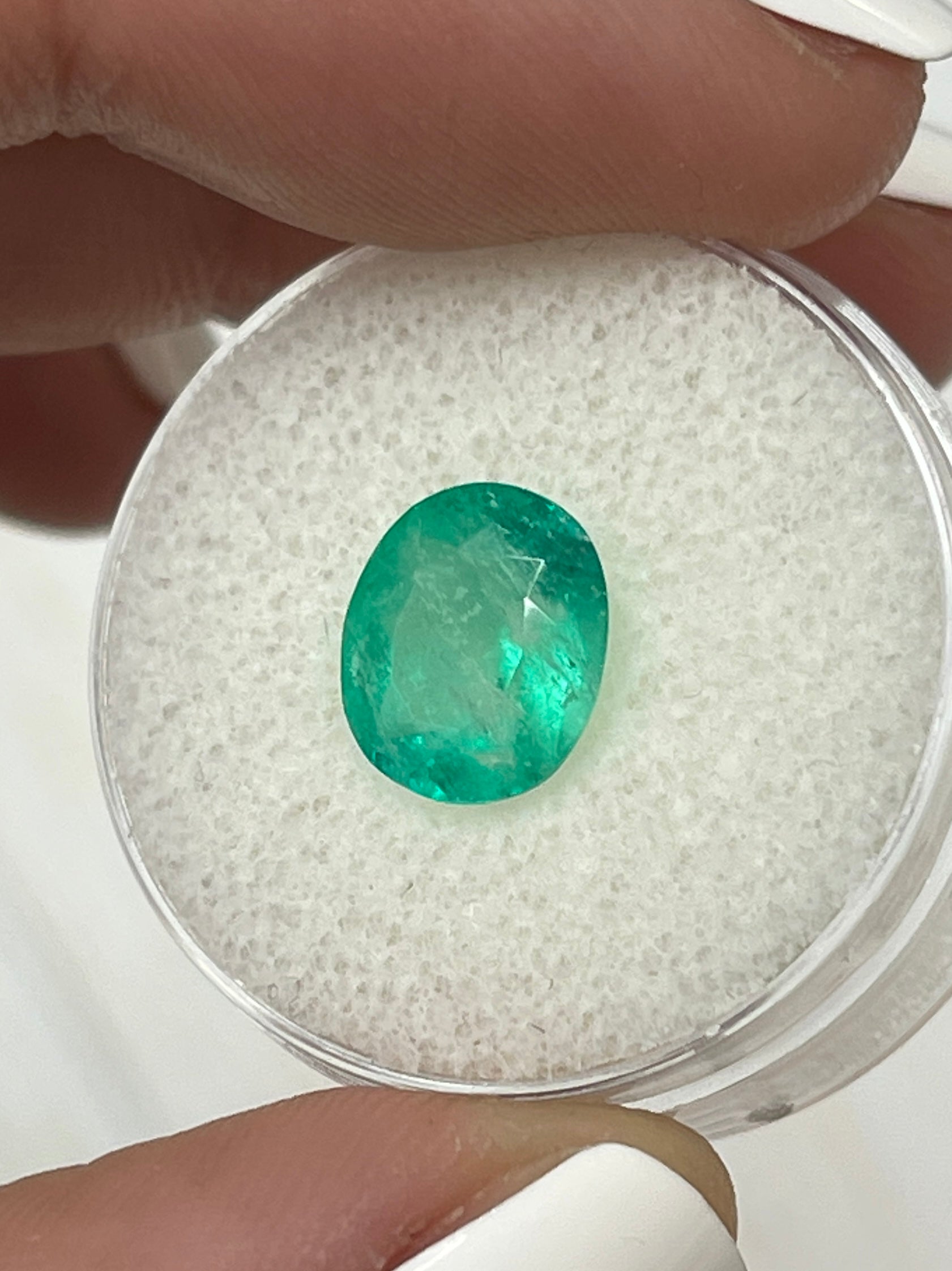 2.53 carat green natural Colombian emerald loose oval cut gemstone from JR Colombian Emeralds, showcasing vibrant color and clarity.