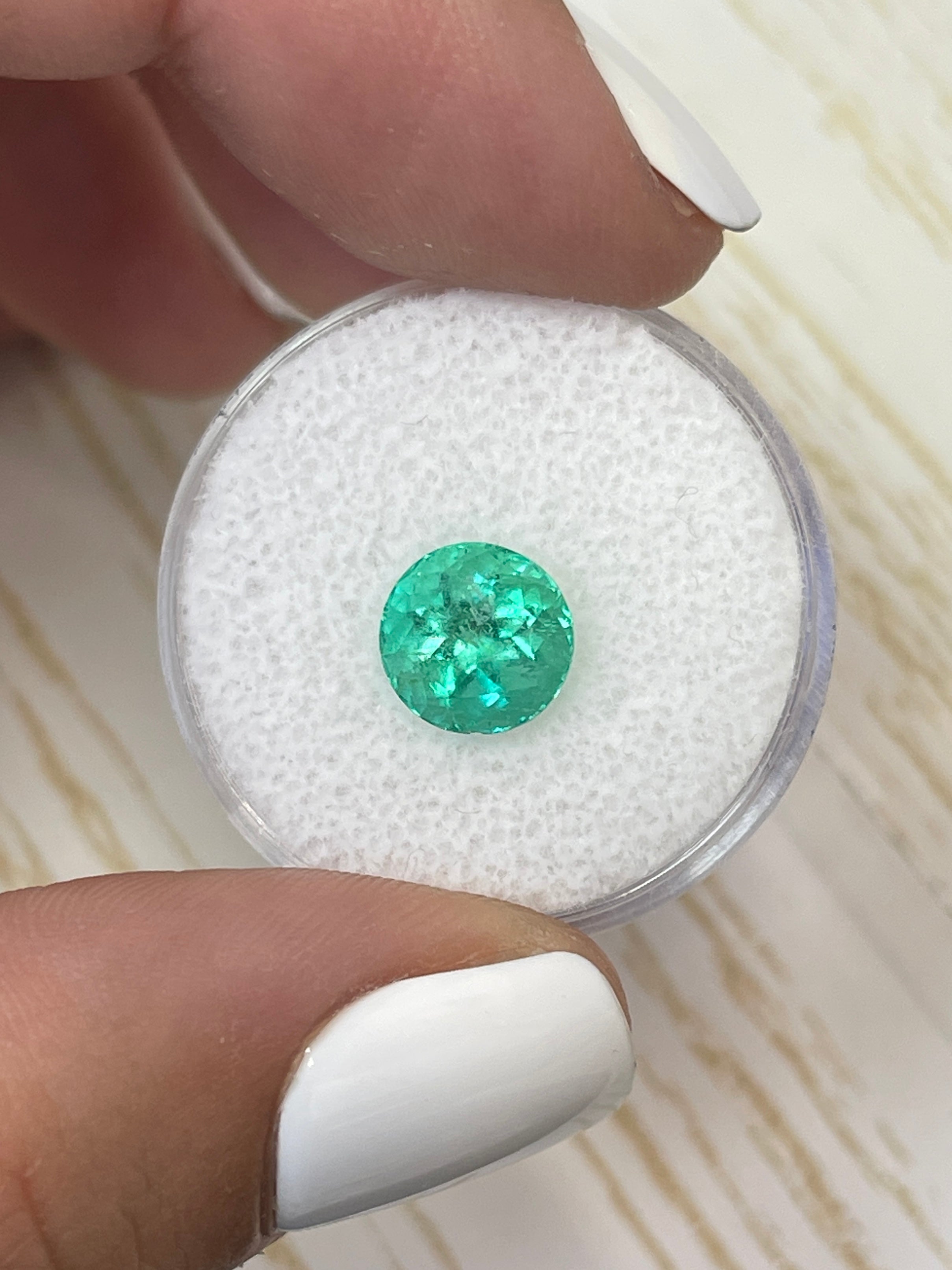 Round 8x8 mm natural Colombian emerald with medium green color, loose gemstone weighing 2.56 carats, by JR Colombian Emeralds.