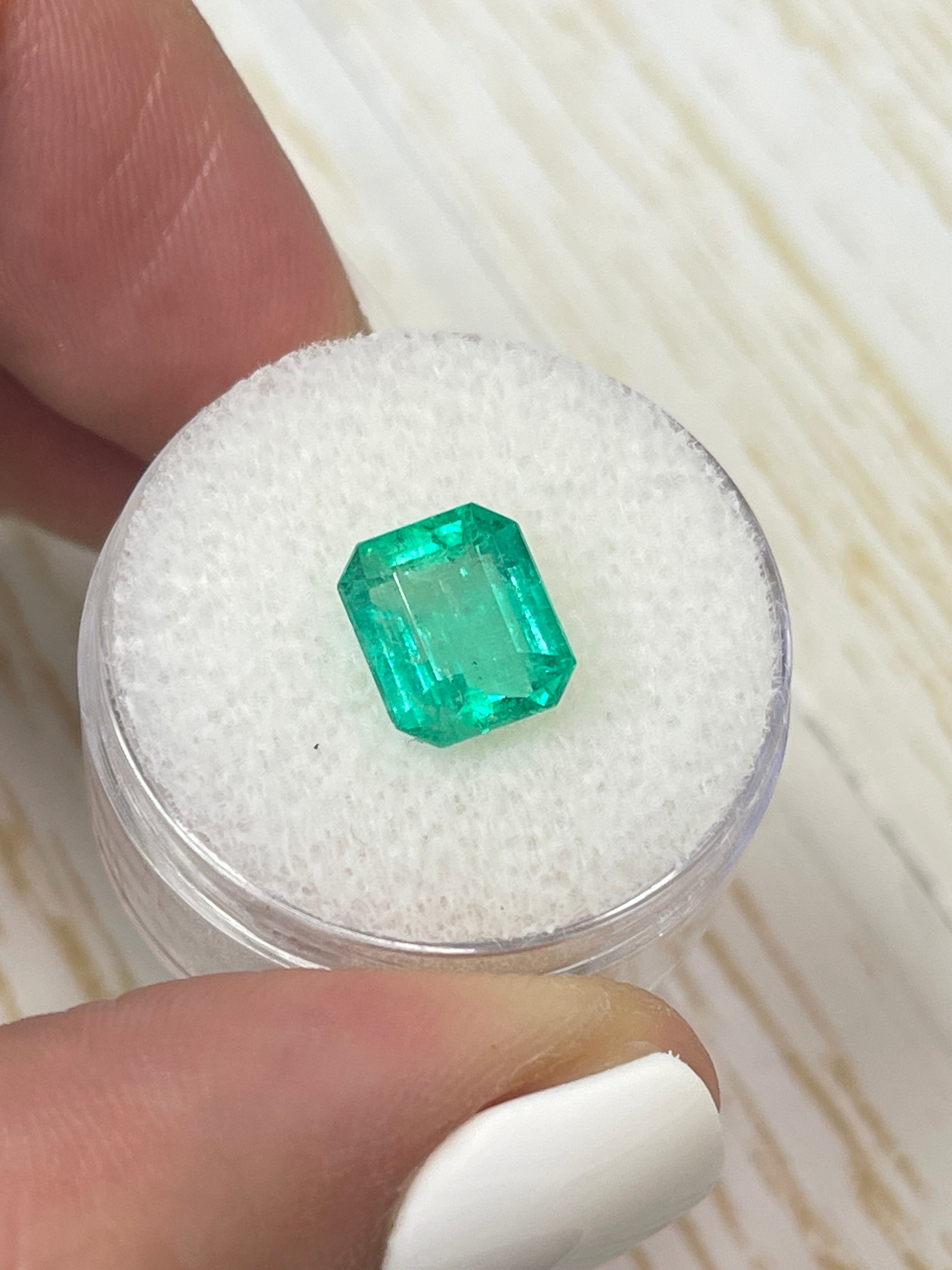2.68 carat natural Colombian emerald loose gemstone in emerald cut, showcasing vibrant green color and chunky size.