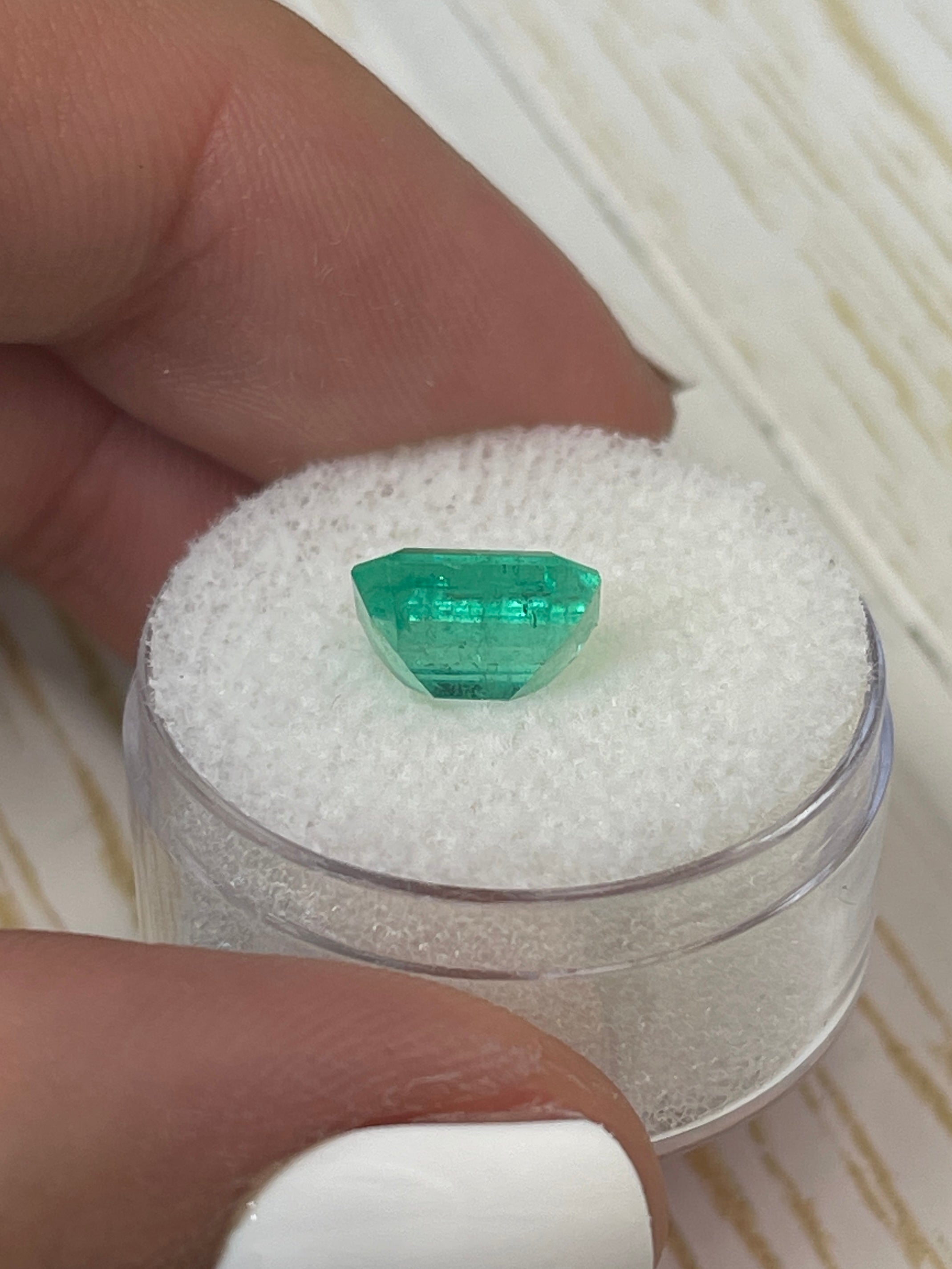 2.68 carat natural Colombian emerald loose gemstone in an emerald cut, showcasing a chunky, vibrant green with rich color and clarity.