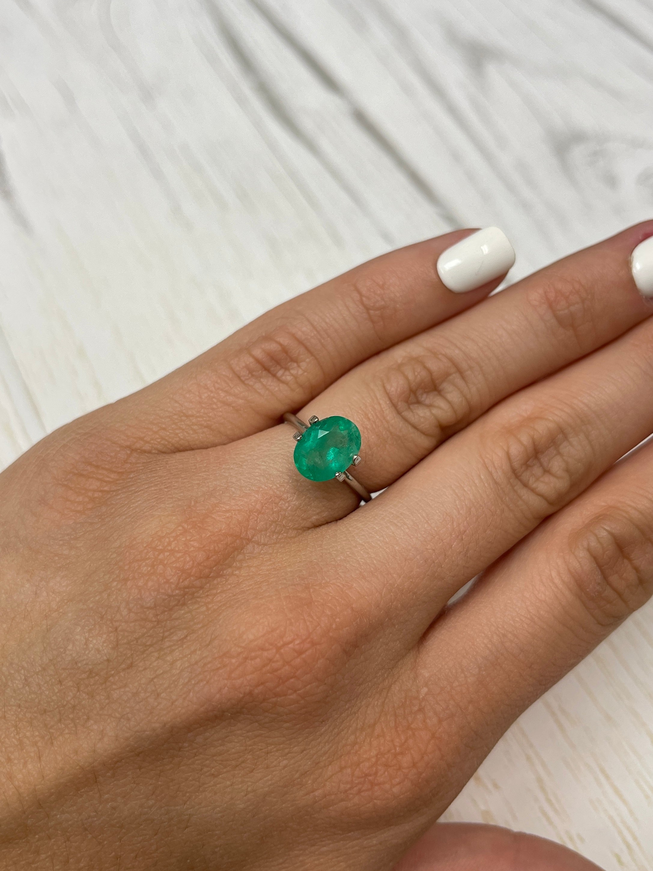 2.69 carat natural oval-cut Colombian emerald loose gemstone from JR Colombian Emeralds, vibrant green color and polished surface