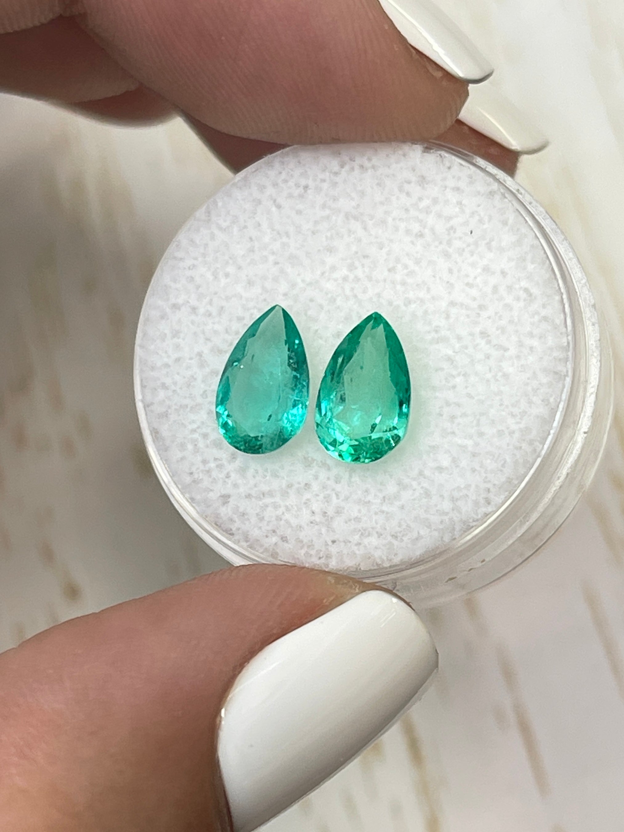 14k yellow gold Luke custom emerald and diamond earrings with 2.71tcw pear cut Colombian emeralds and matching loose emeralds.