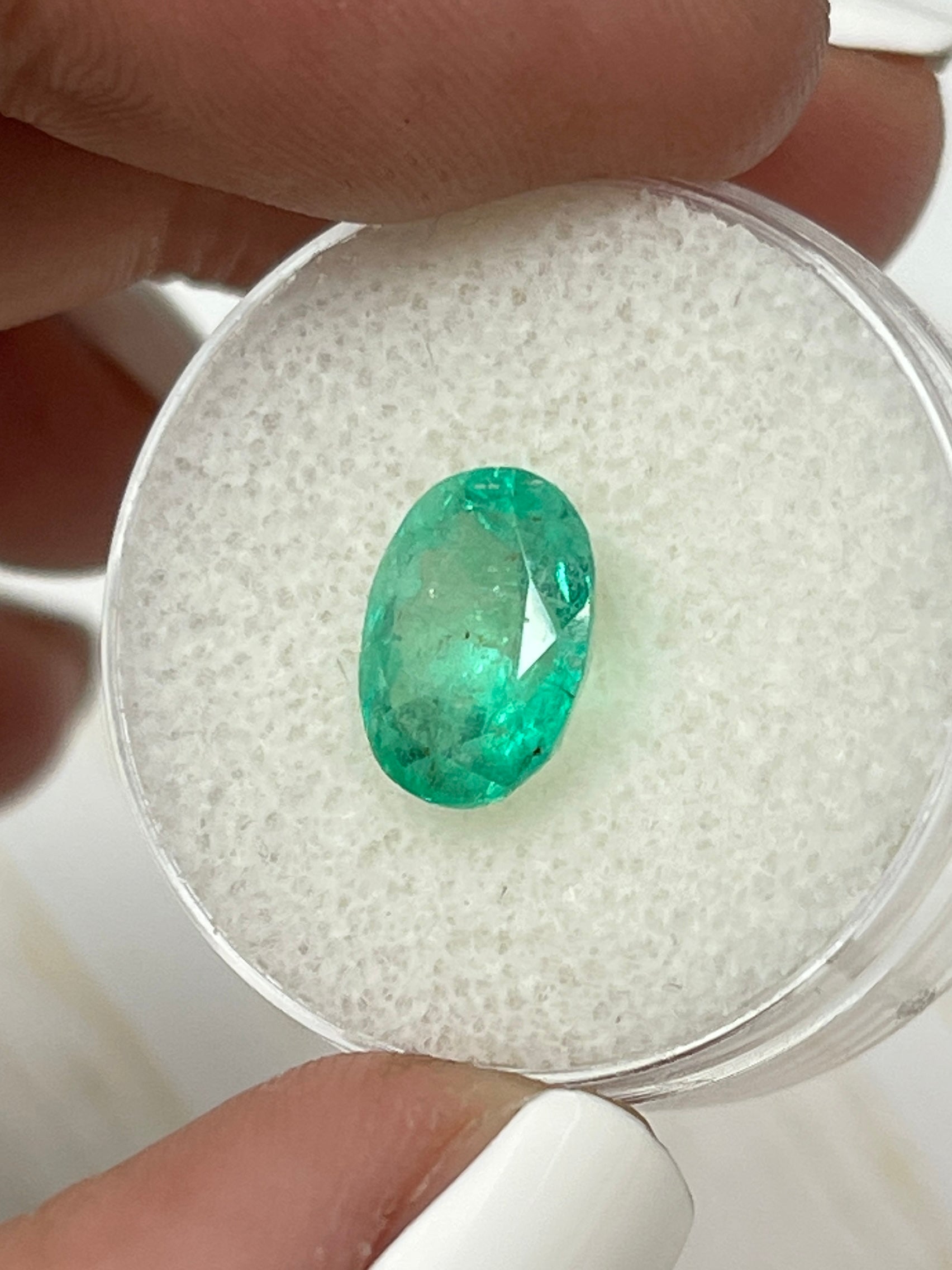 2.75 carat lightly freckled green Colombian emerald loose oval-cut gemstone from JR Colombian Emeralds.