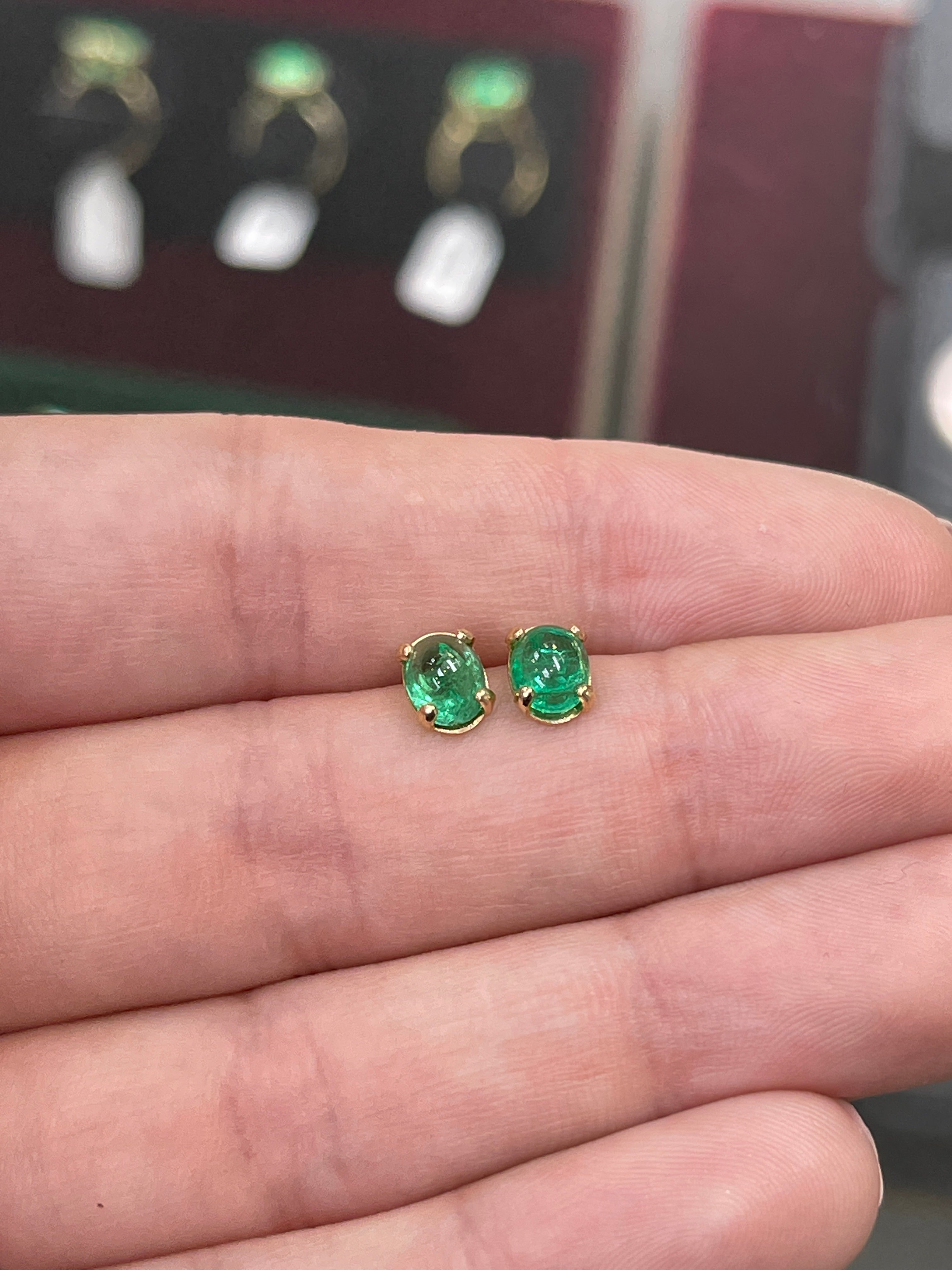 Deep green emerald oval cabochon solitaire stud earrings in 14K gold by JR Colombian Emeralds featuring 2.78tcw gemstones.