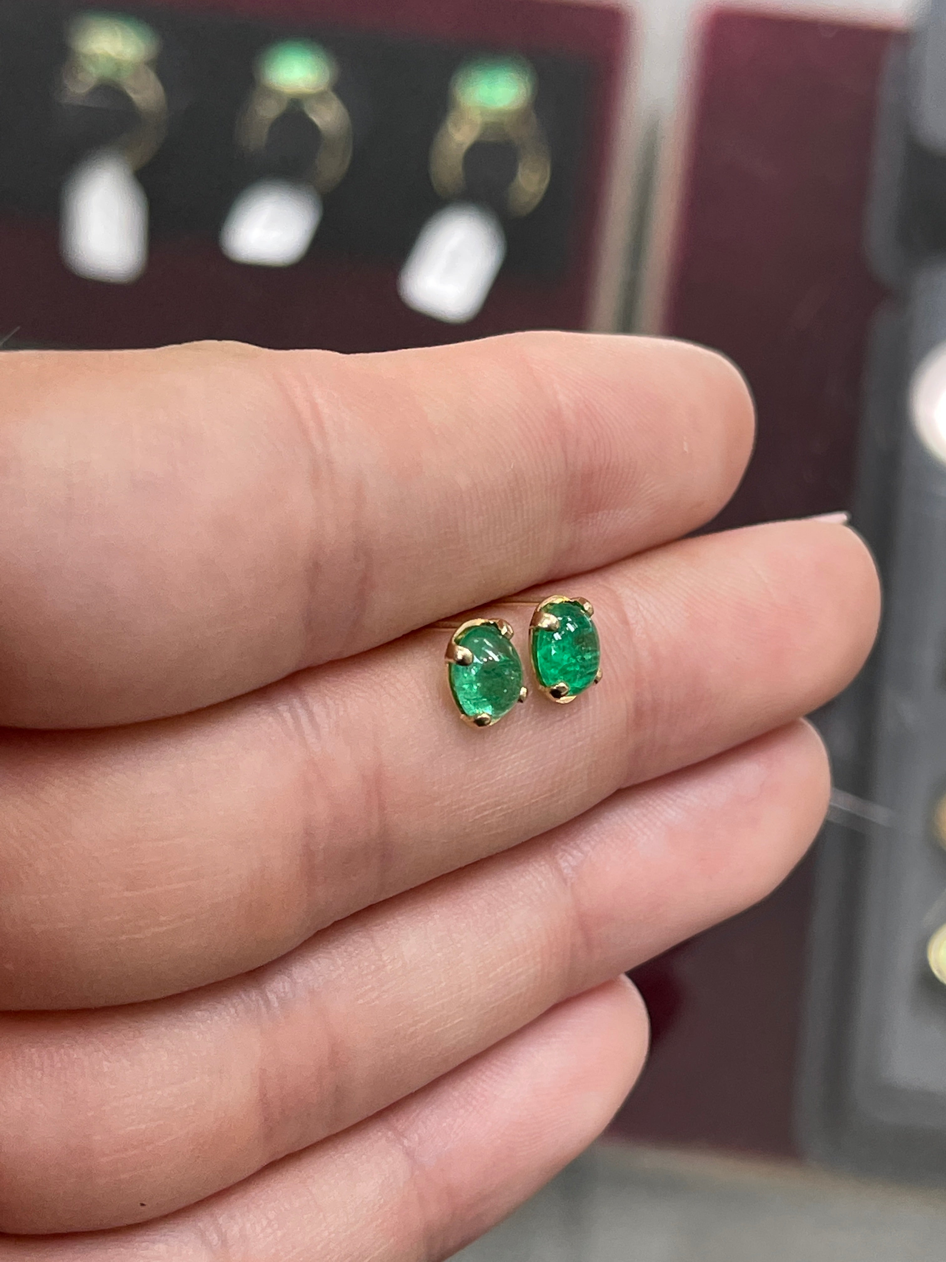 Deep green emerald oval cabochon solitaire stud earrings in 14K gold by JR Colombian Emeralds.