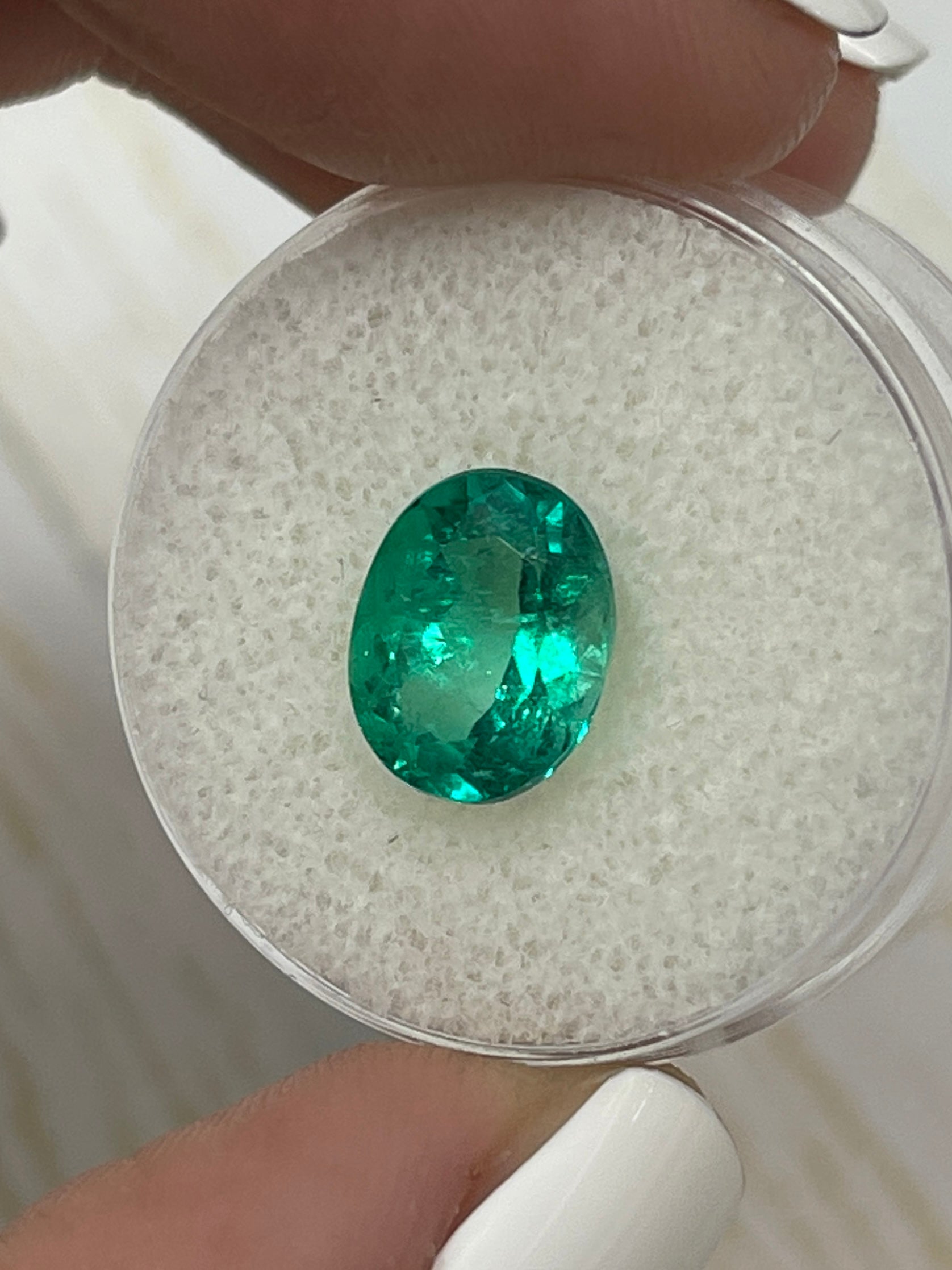 Vivid bluish green 2.80 carat Colombian emerald loose oval cut gemstone by JR Colombian Emeralds.