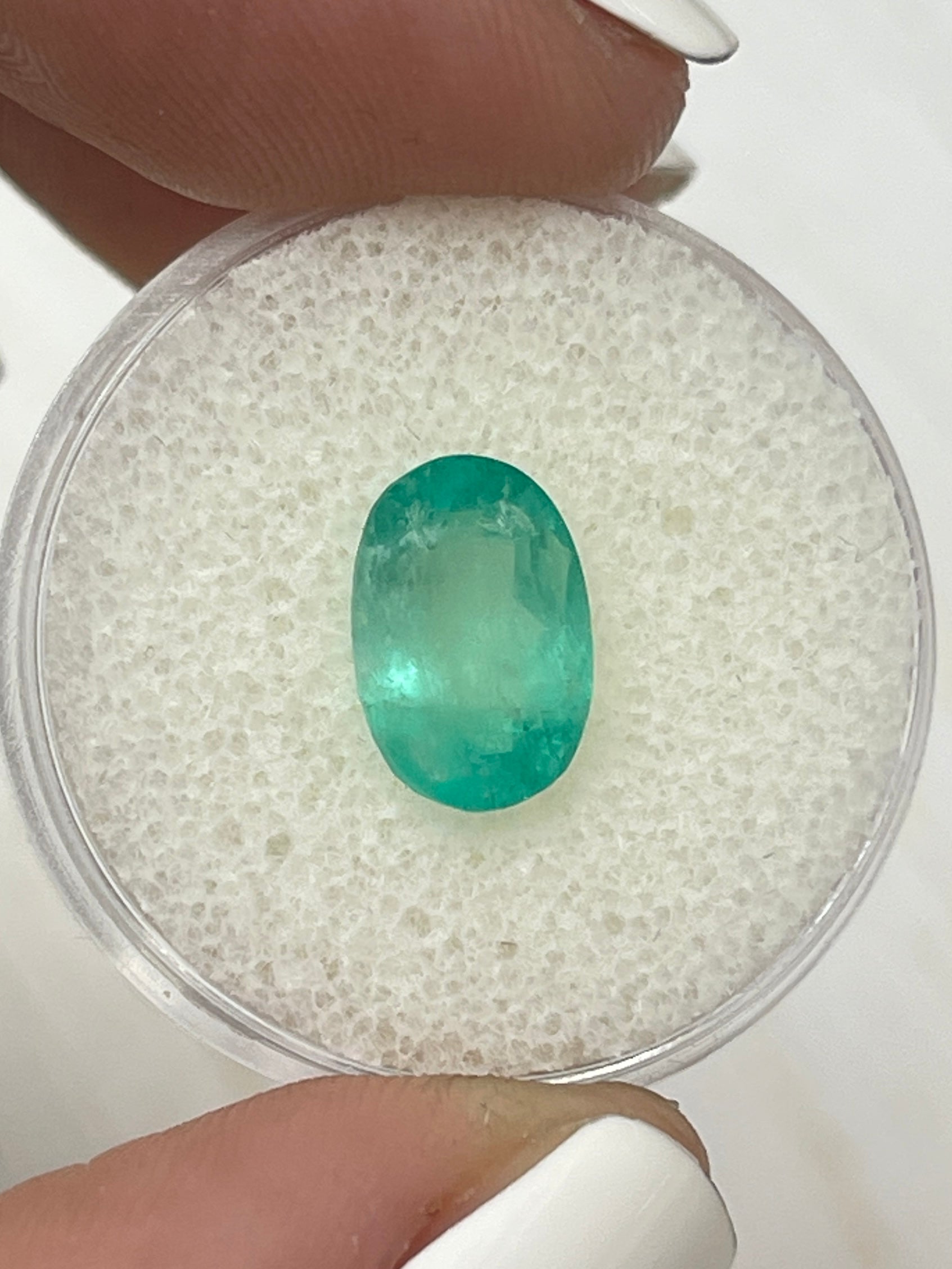 Oval-cut 2.83 carat pastel mint green natural Colombian emerald from JR Colombian Emeralds, loose gemstone with vivid color.