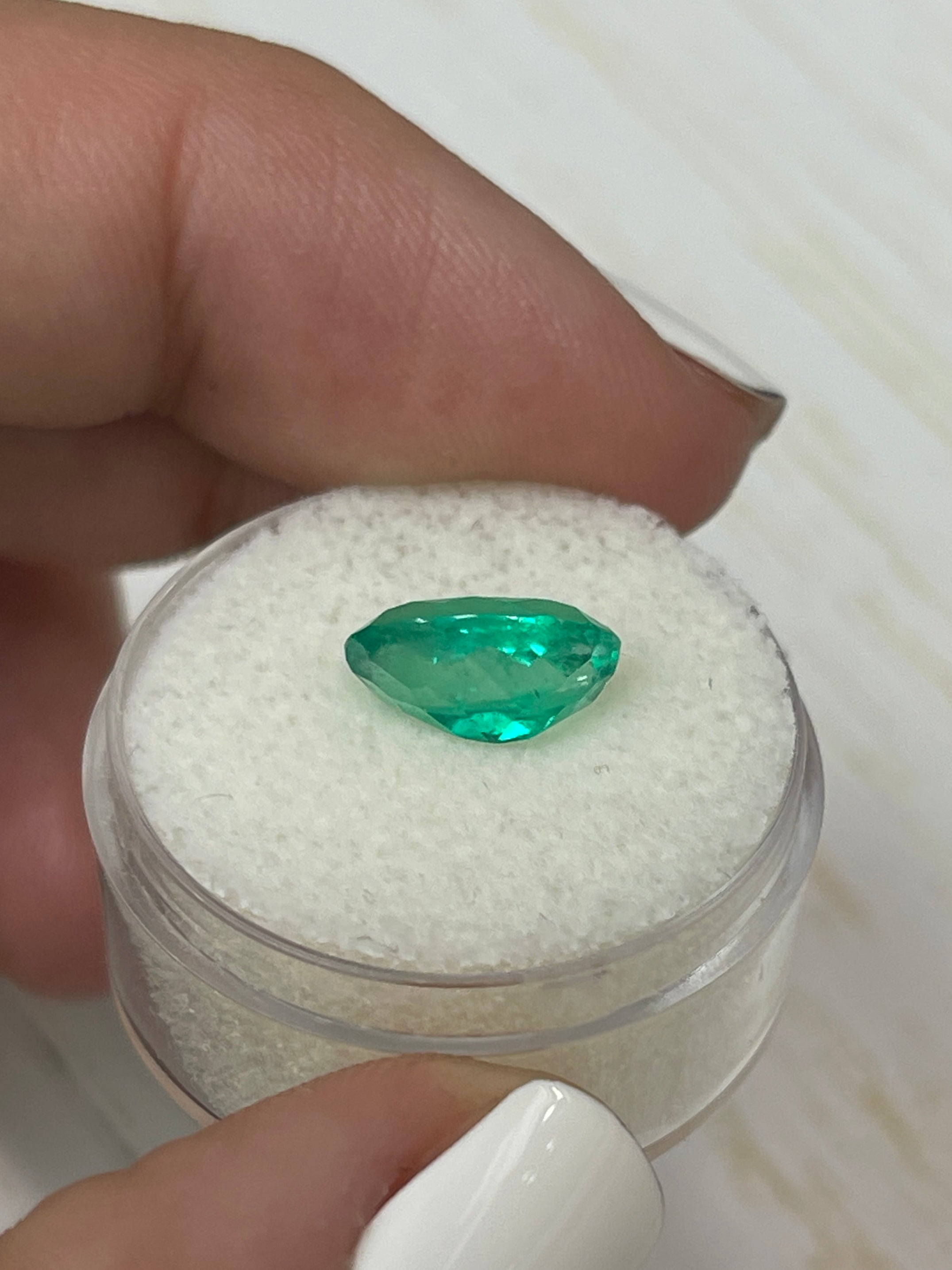 Vibrant green 2.87 carat Colombian emerald in oval cut, loose gemstone with elongated shape from JR Colombian Emeralds.