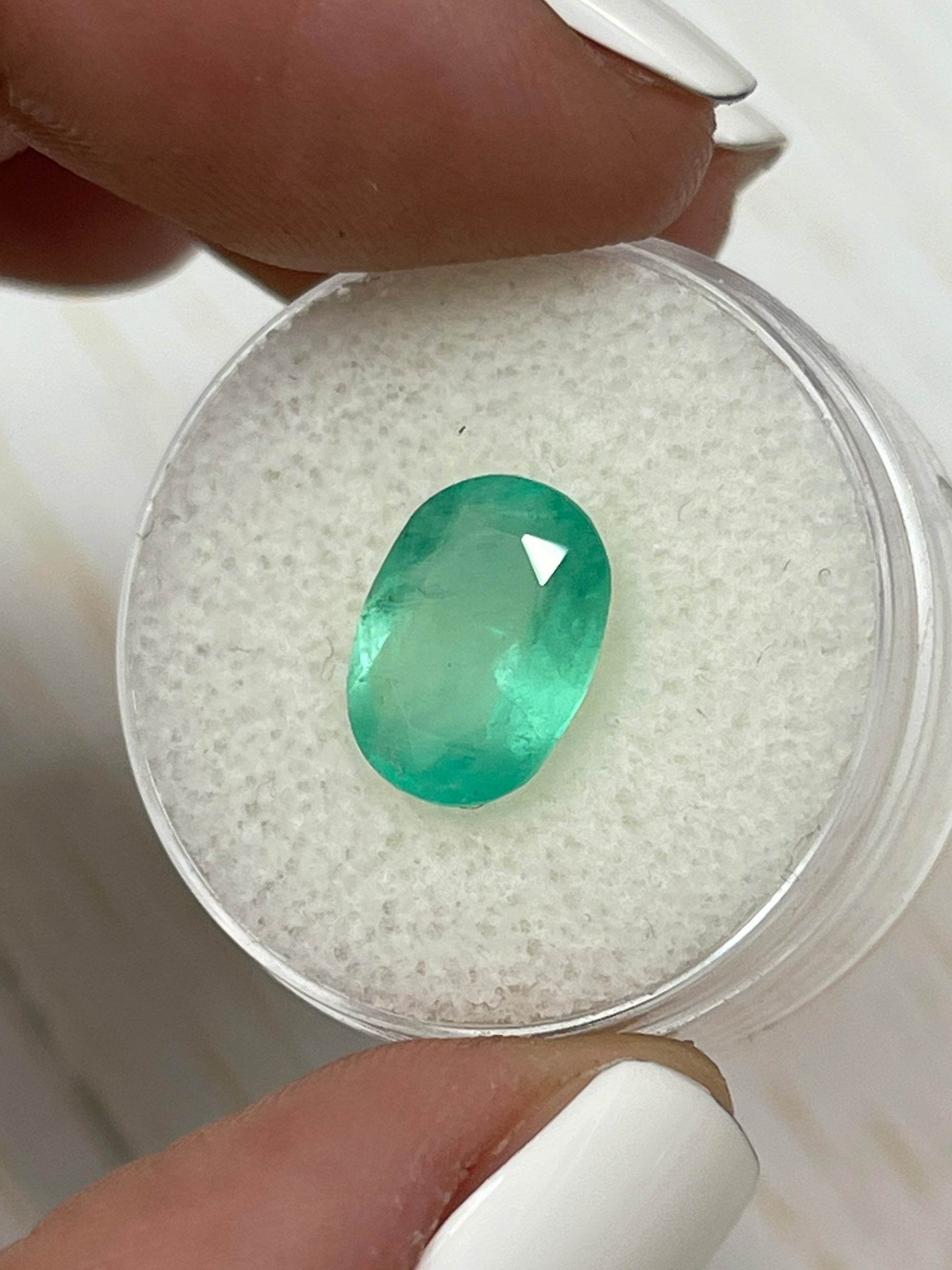 2.90 carat pastel mint green natural Colombian emerald loose oval-cut gemstone with vivid color and clarity.