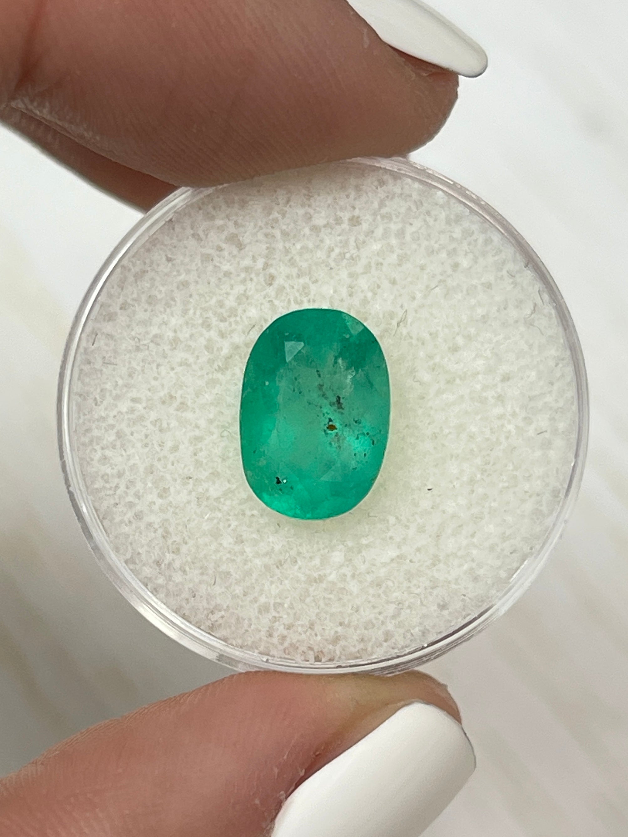 Freckled medium green Colombian emerald, oval cut, 2.95 carats, 11.3x8mm loose gemstone by JR Colombian Emeralds.