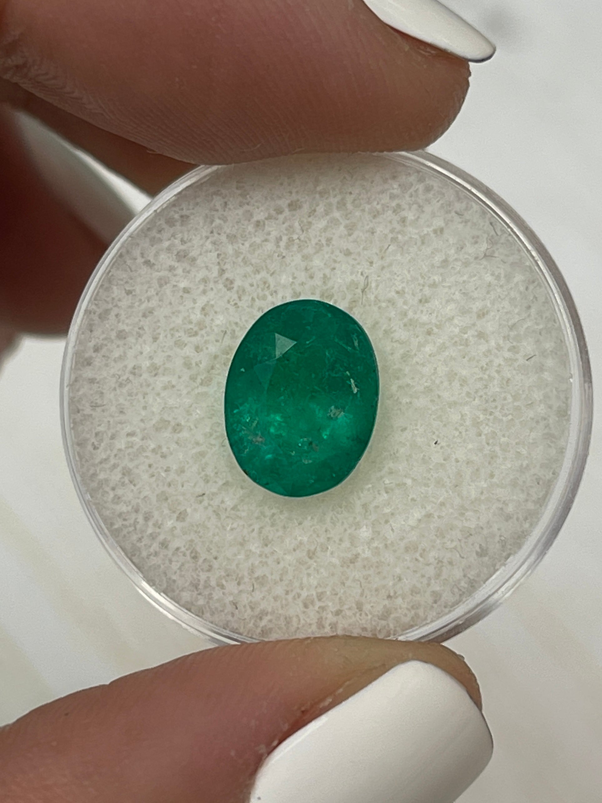 2.98 carat intense dark green Colombian emerald loose oval cut gemstone from JR Colombian Emeralds.