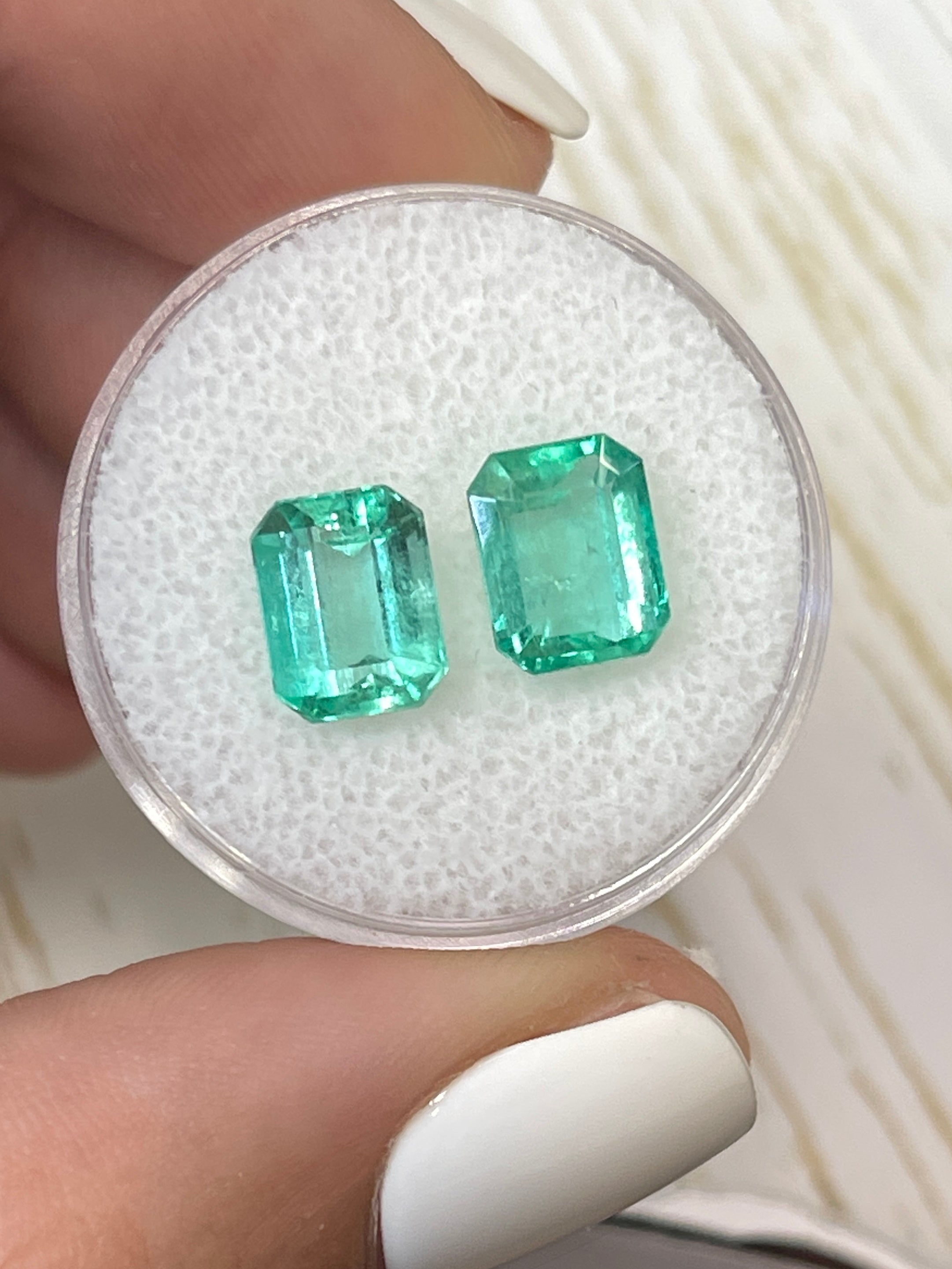Three 3.03-carat total weight Colombian emeralds in 8x6mm emerald cut, loose green Colombian emeralds by JR Colombian Emeralds.
