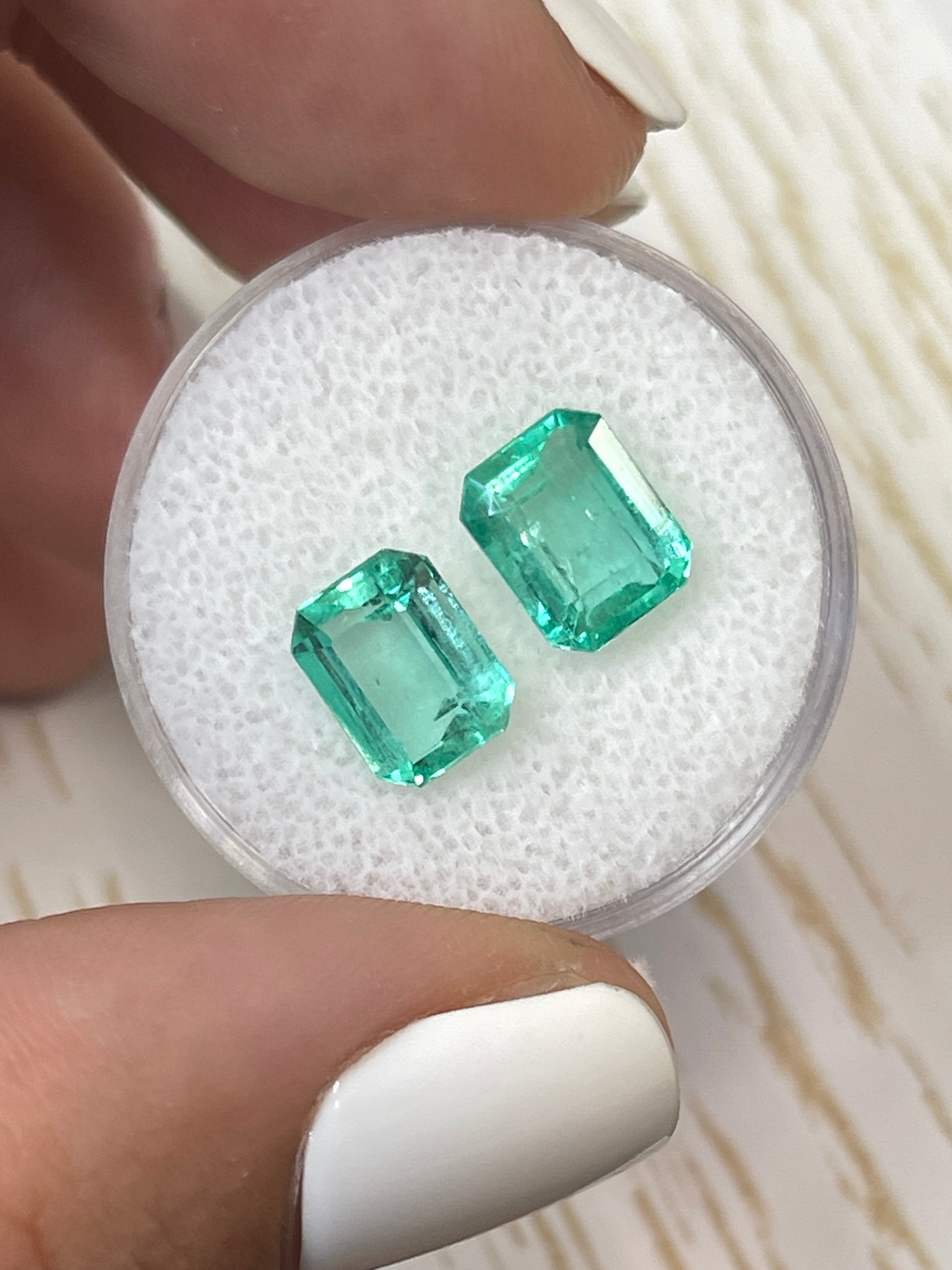 Pair of 3.03 carat total weight Colombian emeralds in 8x6mm emerald cut, matching green loose gemstones by JR Colombian Emeralds.