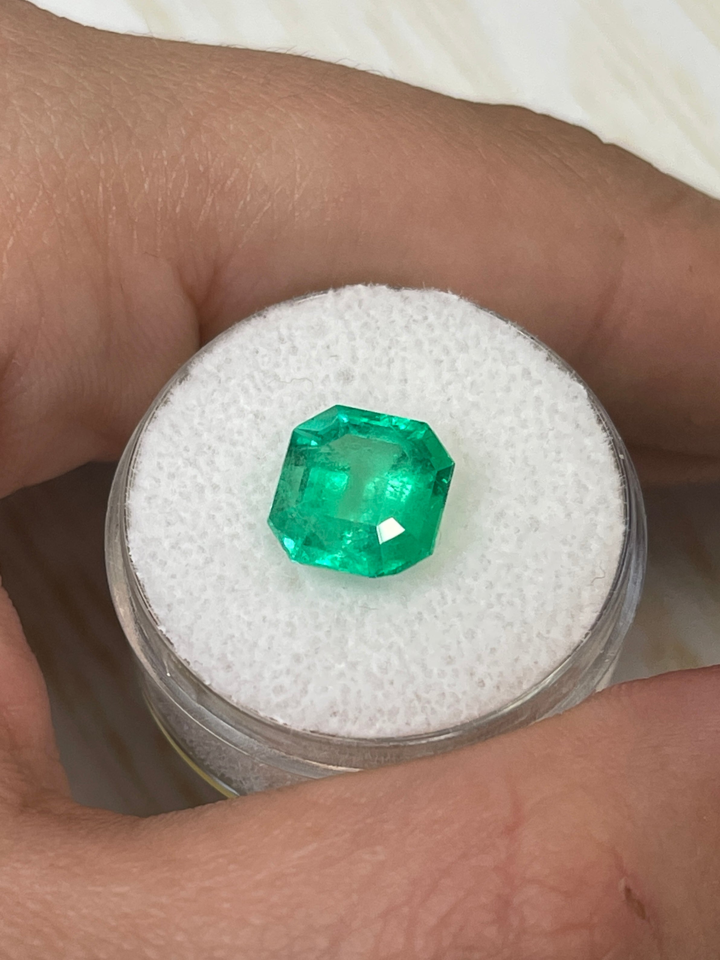 9x9mm yellowish green natural Colombian emerald in Asscher cut, 3.21 carats, loose gemstone from JR Colombian Emeralds.