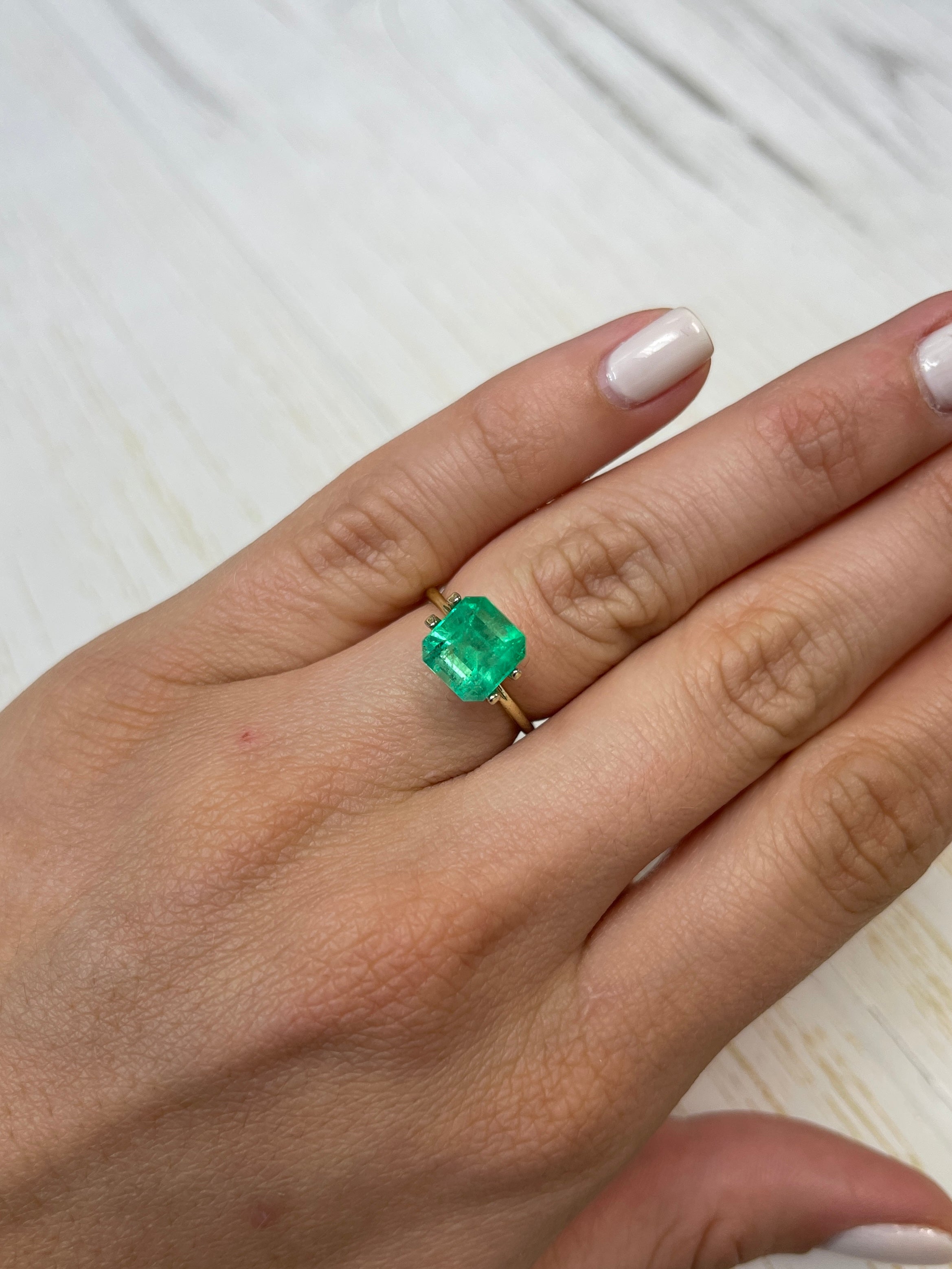 Natural 3.28 carat spring green Colombian emerald loose Asscher cut gemstone, showcasing vibrant color and clarity.