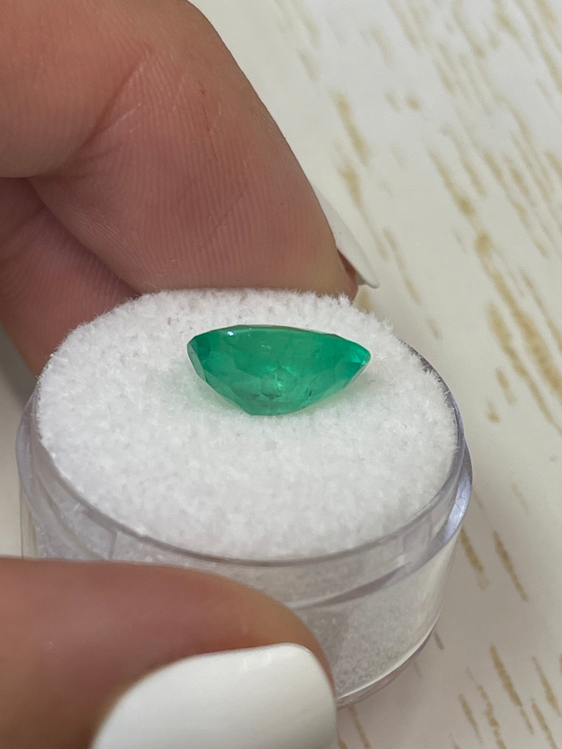 3.32 carat neon green natural Colombian emerald in oval cut, displayed as a loose gemstone with vibrant color and clarity.