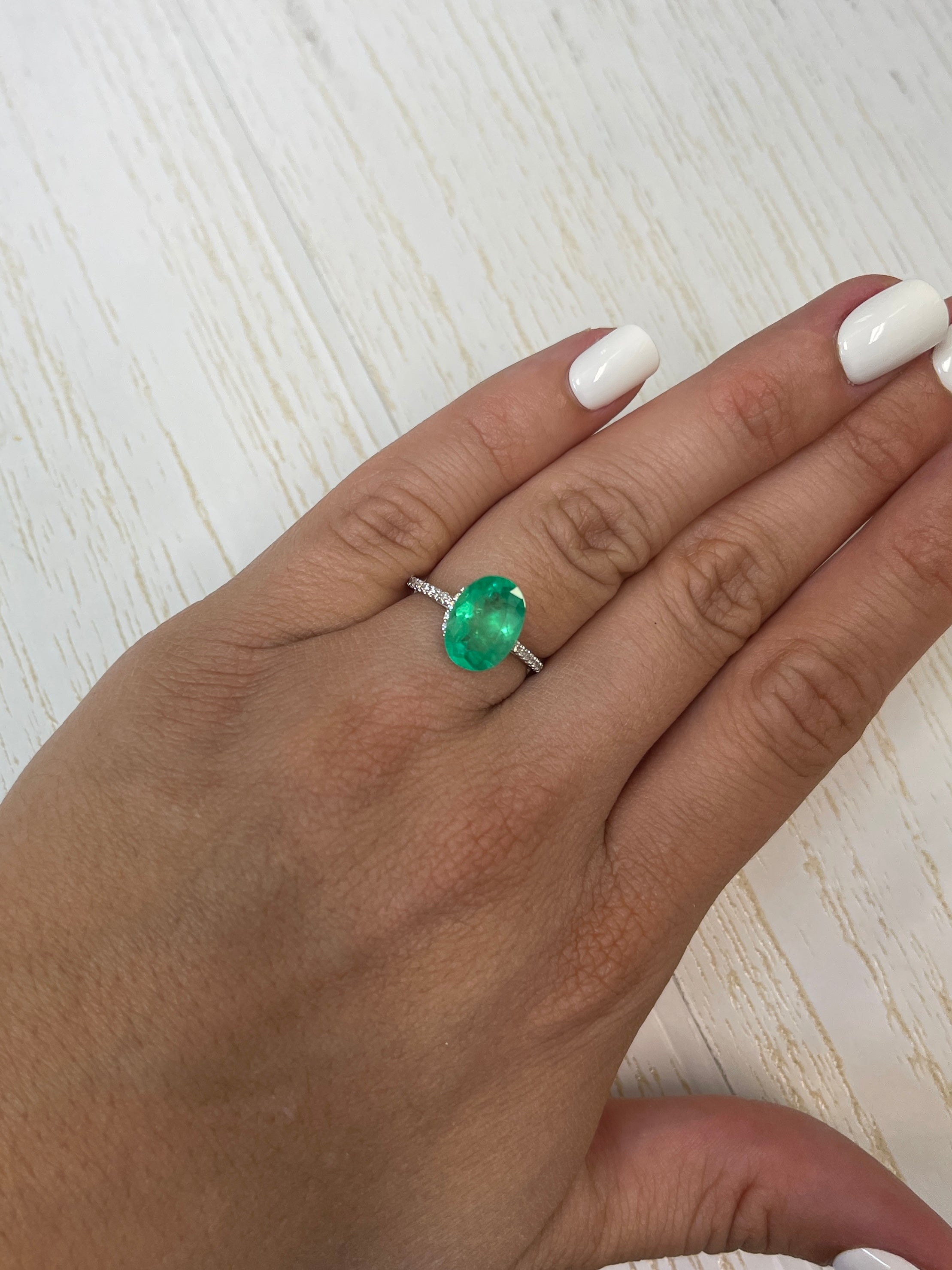 3.32 carat neon green natural Colombian emerald loose oval cut gemstone from JR Colombian Emeralds.