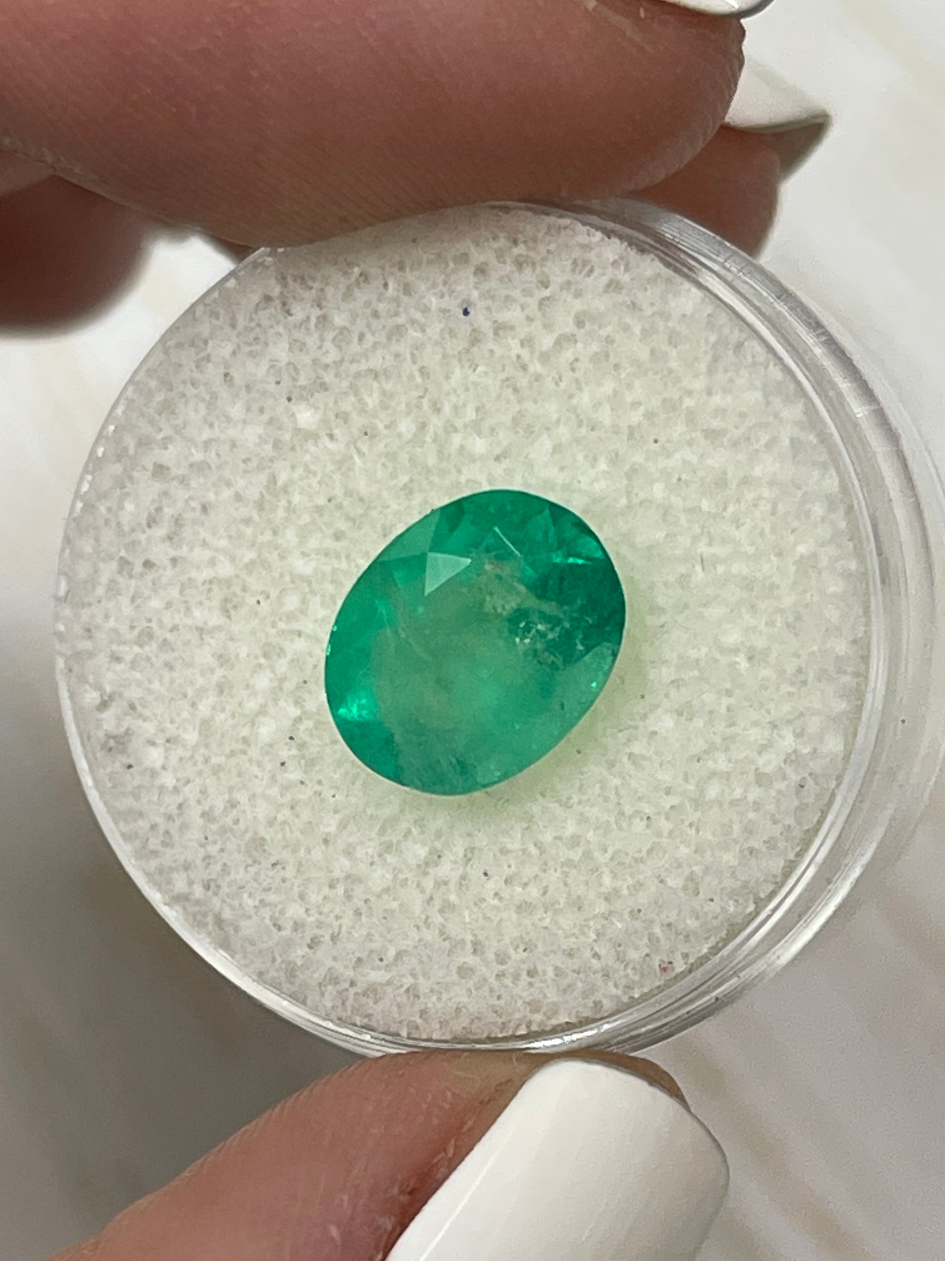 3.48 Carat semi-transparent green Colombian emerald loose gemstone with an oval cut, from JR Colombian Emeralds.