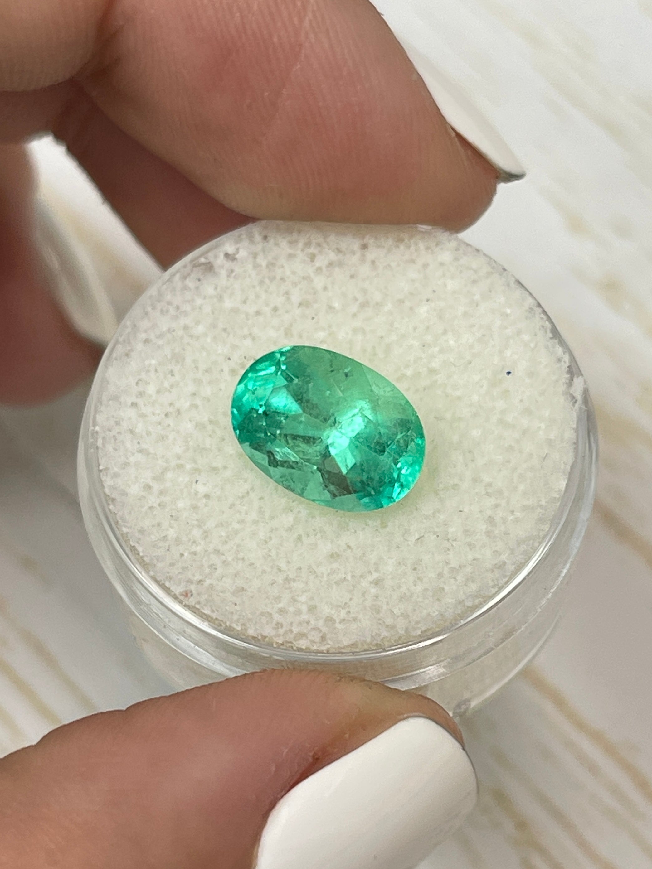 Light bluish green 3.55 carat Colombian emerald in oval cut, loose gemstone from JR Colombian Emeralds.