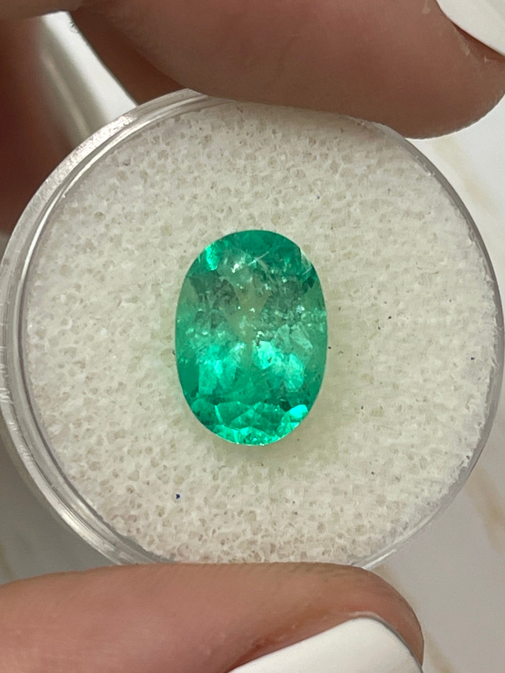 3.56 carat bi-color green Colombian emerald loose oval cut gemstone from JR Colombian Emeralds. Natural, vibrant, and high-quality.