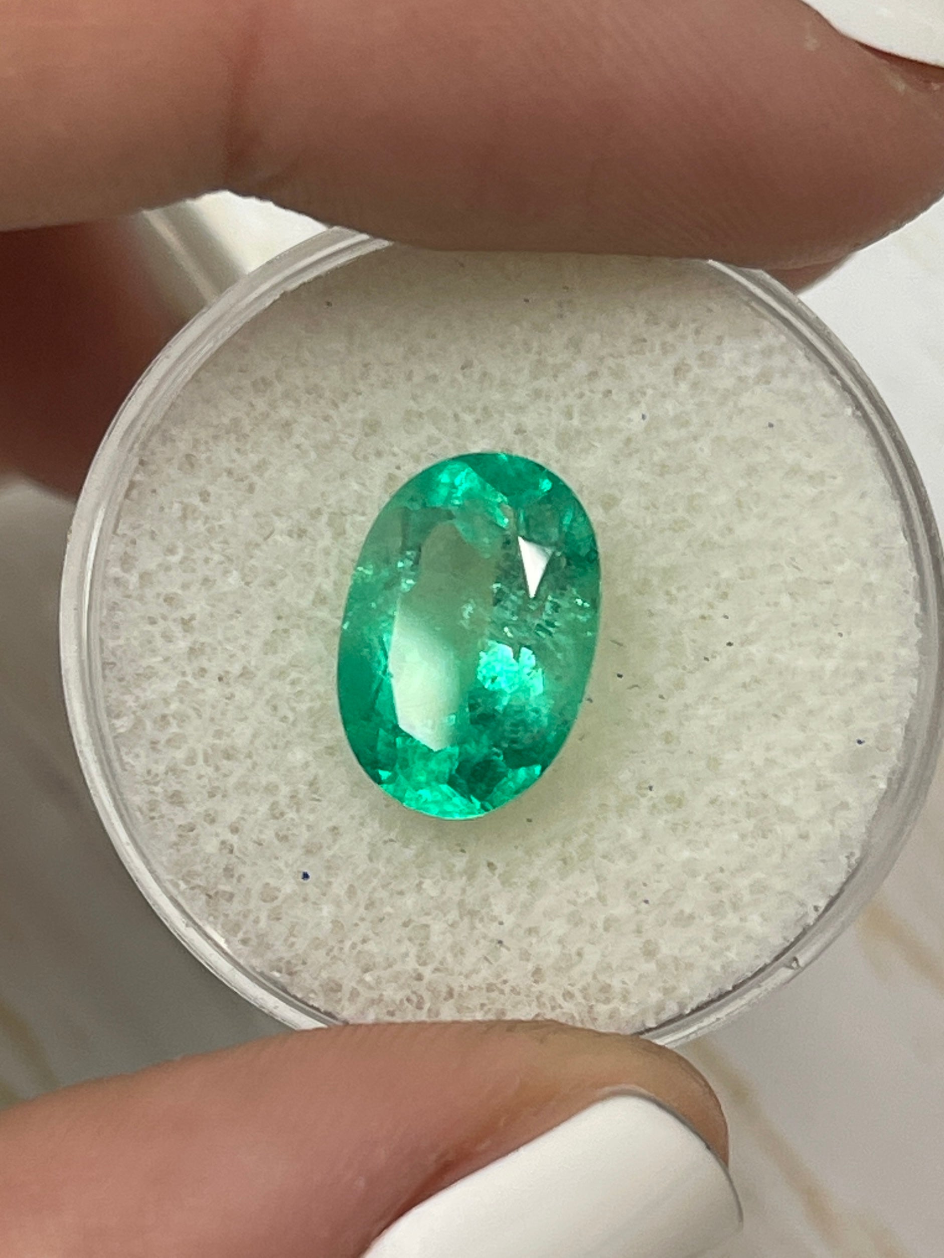 3.56 carat bi-color green Colombian emerald loose oval cut gemstone from JR Colombian Emeralds