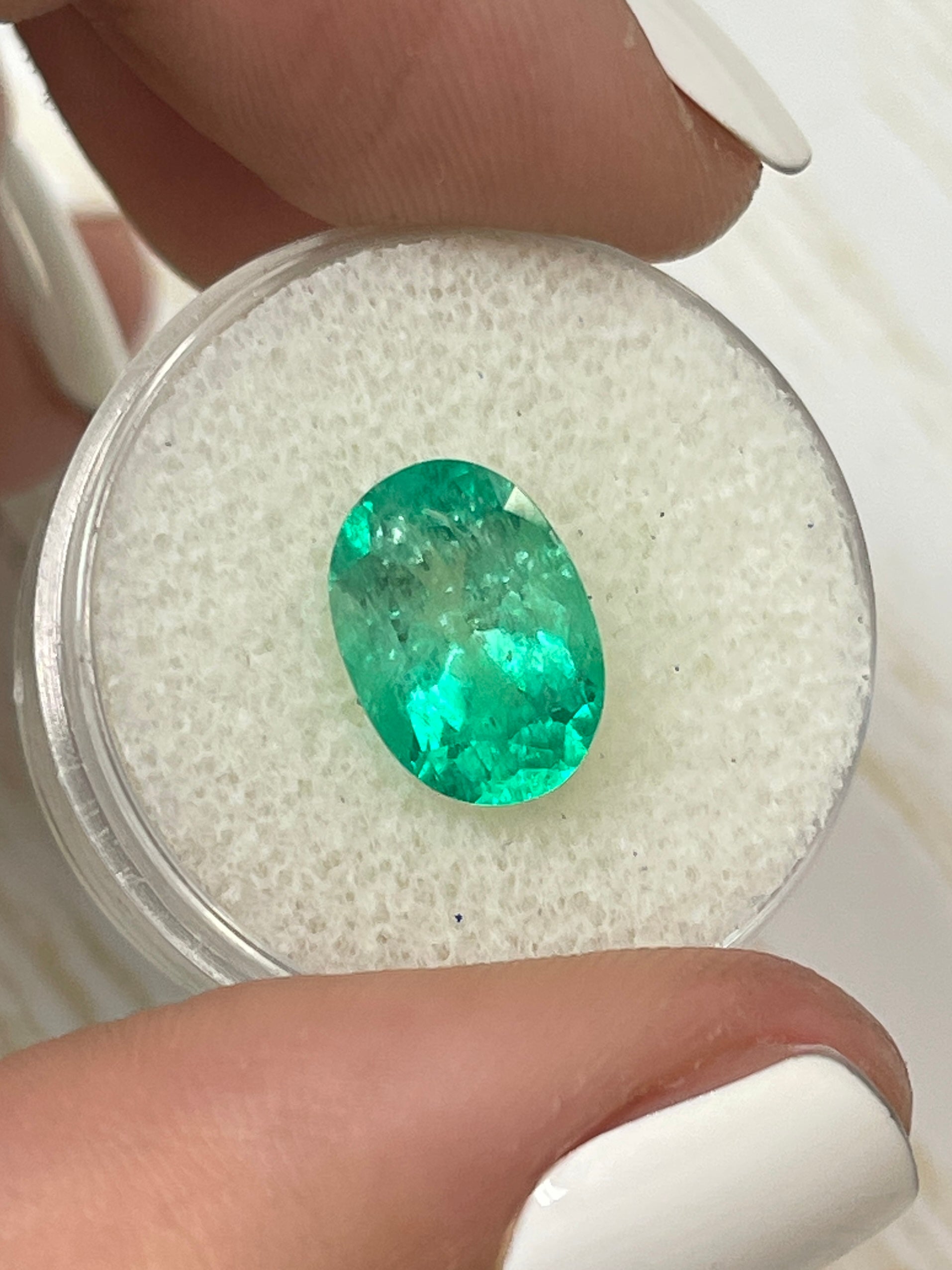 3.56 carat bi-color green natural Colombian emerald loose oval cut gemstone from JR Colombian Emeralds.