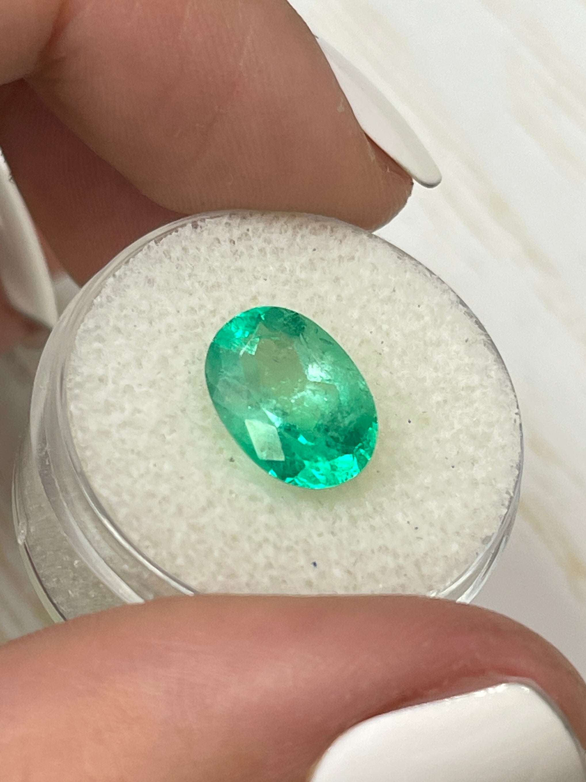 3.56 carat bi-color green natural Colombian emerald loose oval cut gemstone from JR Colombian Emeralds