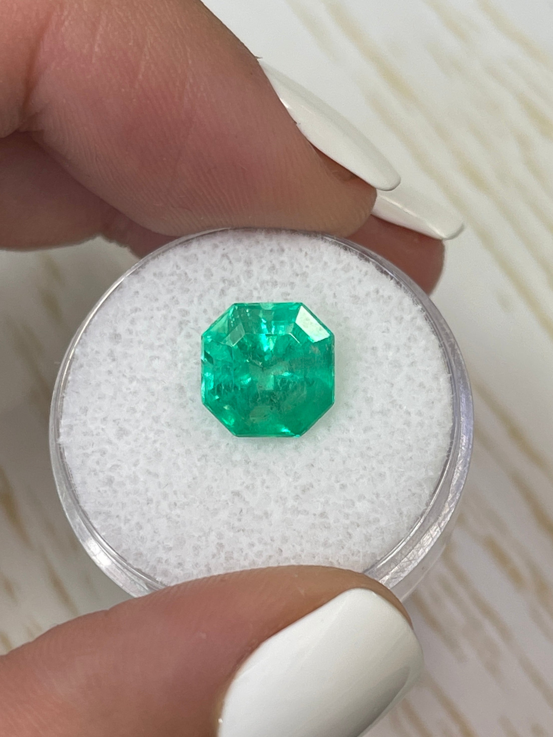 Luminous 3.68 Carat natural Colombian emerald loose Asscher cut with clipped corners, showcasing vibrant green color and clarity.