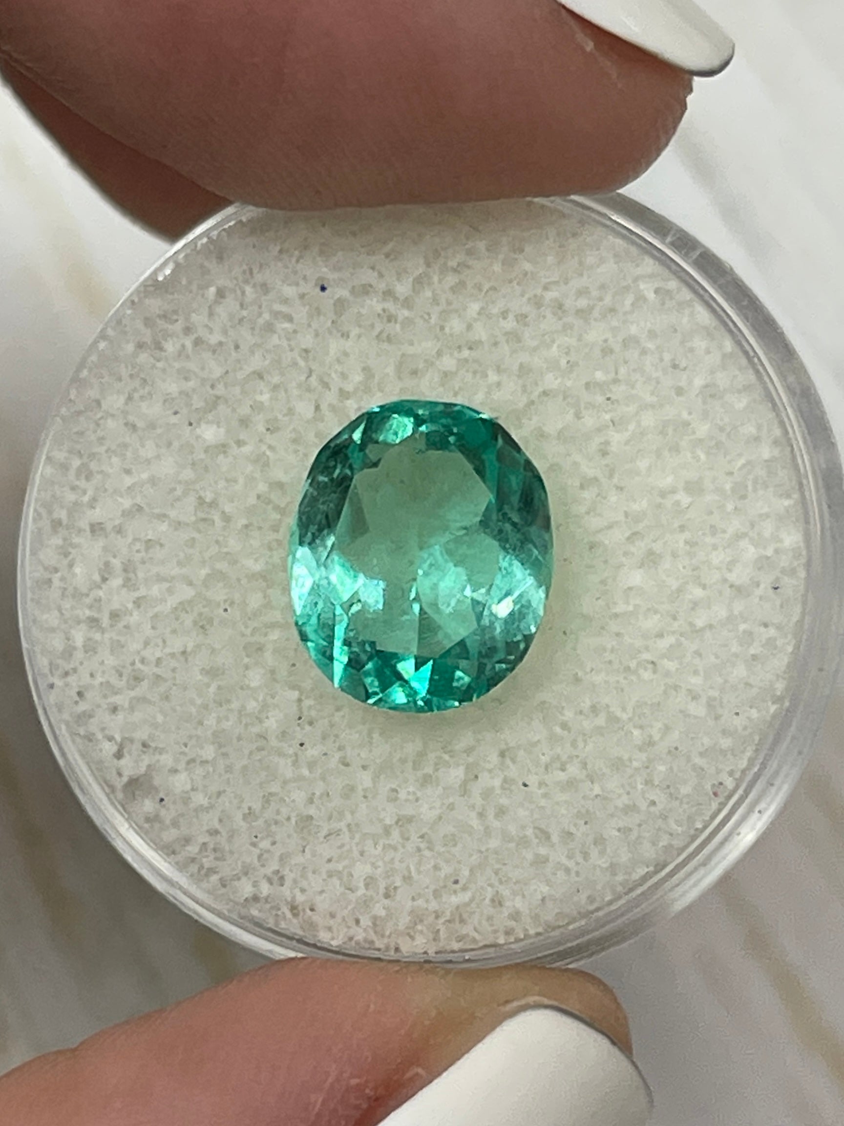 3.70 carat oval cut Colombian emerald from JR Colombian Emeralds showing vibrant green color and VS clarity, unmounted gemstone.