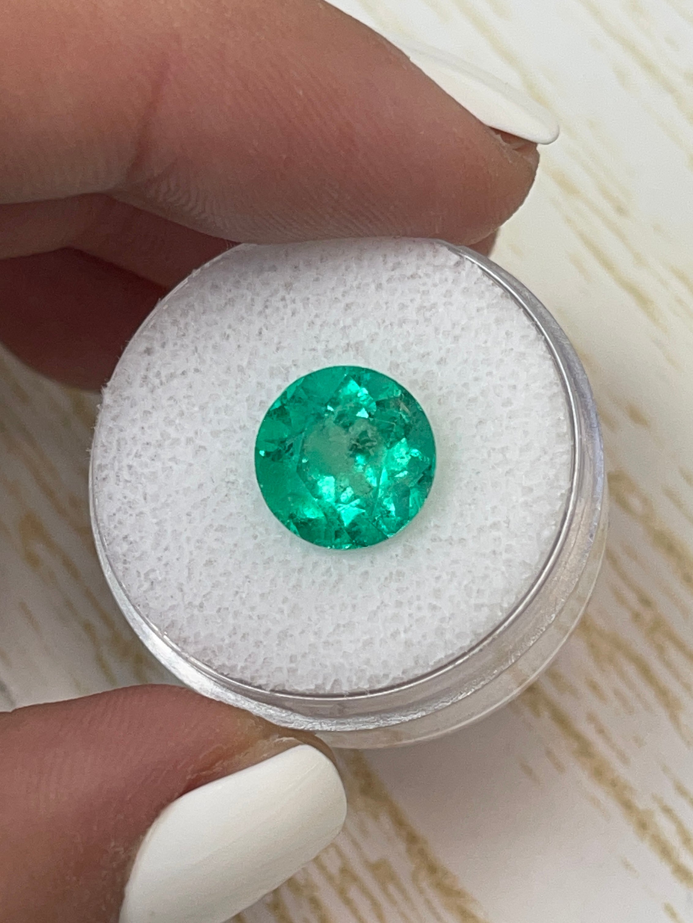 Vibrant green 3.79 carat natural round Colombian emerald loose gemstone with a 10x10mm cut from JR Colombian Emeralds