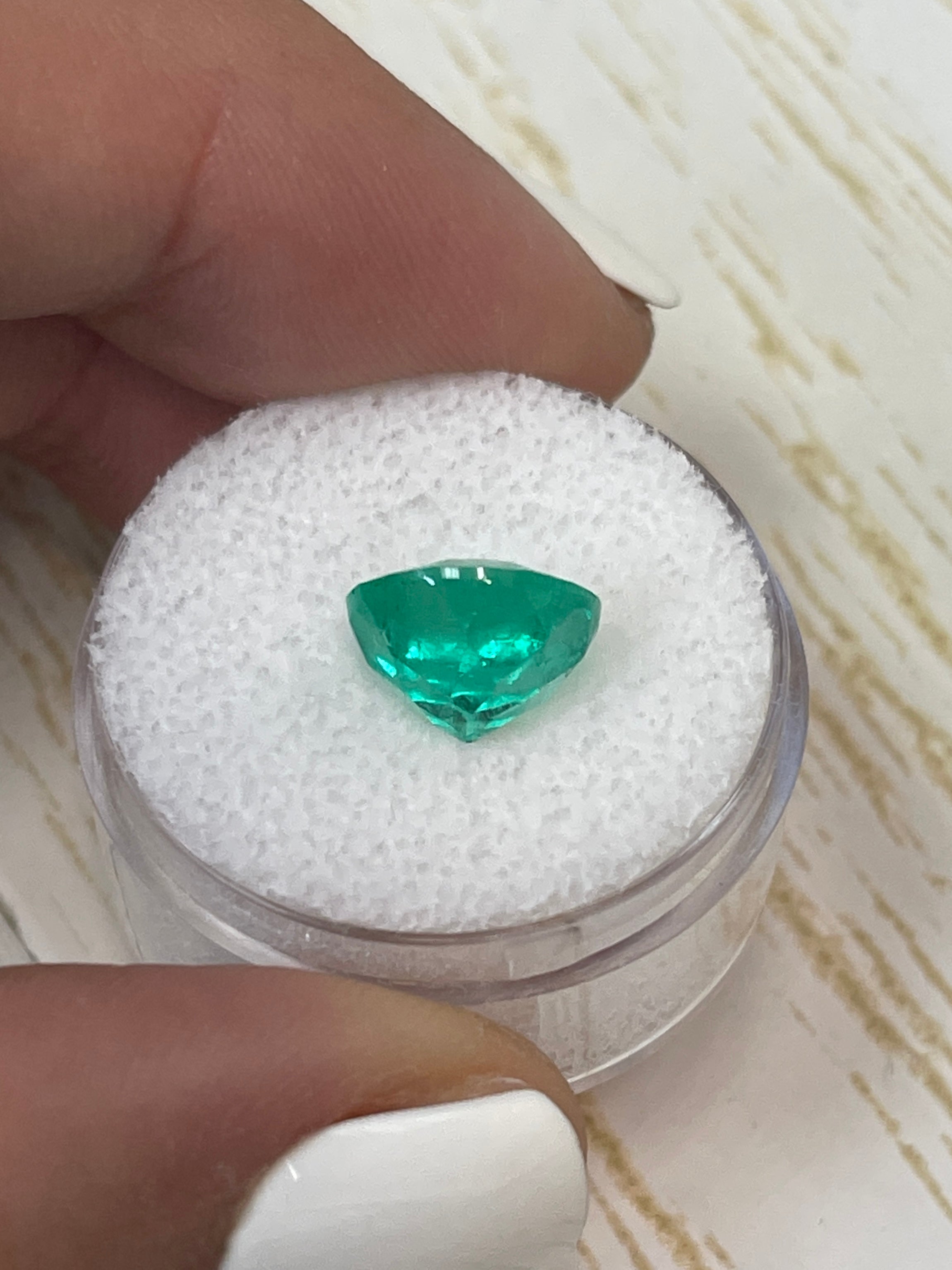 Vibrant green 3.79 carat natural round Colombian emerald loose gemstone with a 10x10mm cut, from JR Colombian Emeralds.