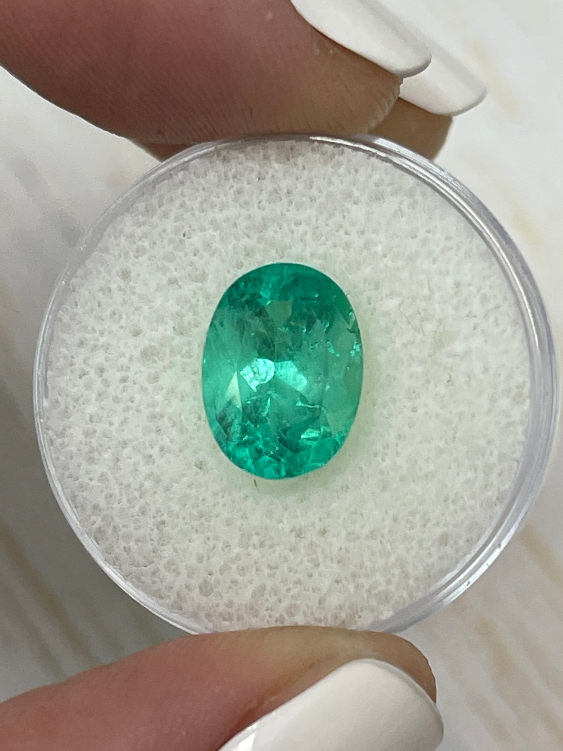 Vibrant spring green 3.86 carat natural Colombian emerald loose oval cut gemstone from JR Colombian Emeralds