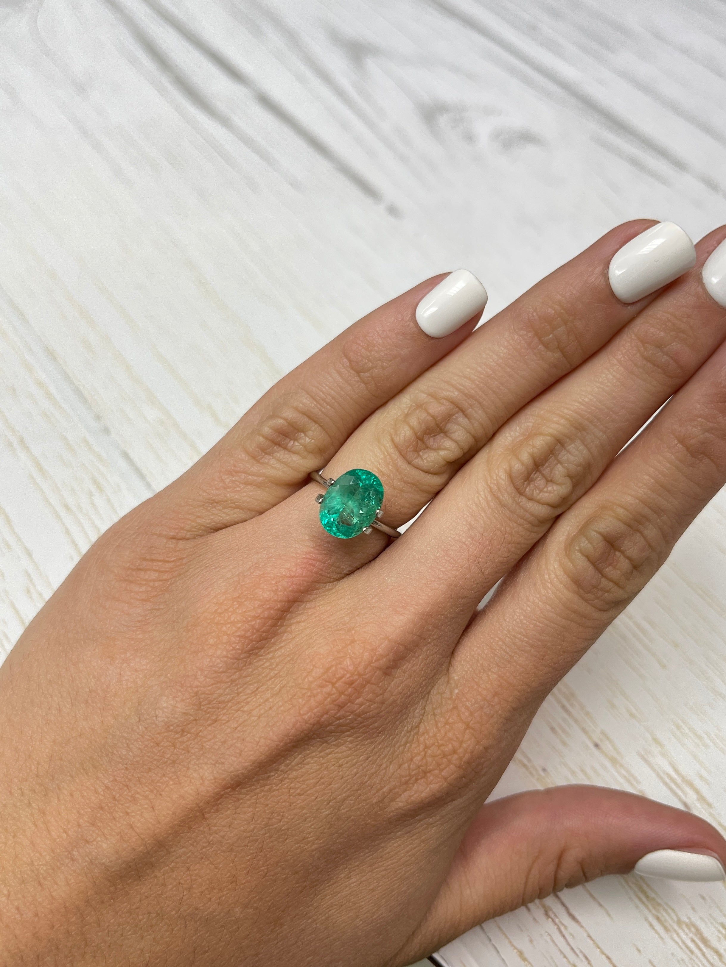 Vibrant spring green 3.86 carat oval cut natural Colombian emerald loose gemstone by JR Colombian Emeralds