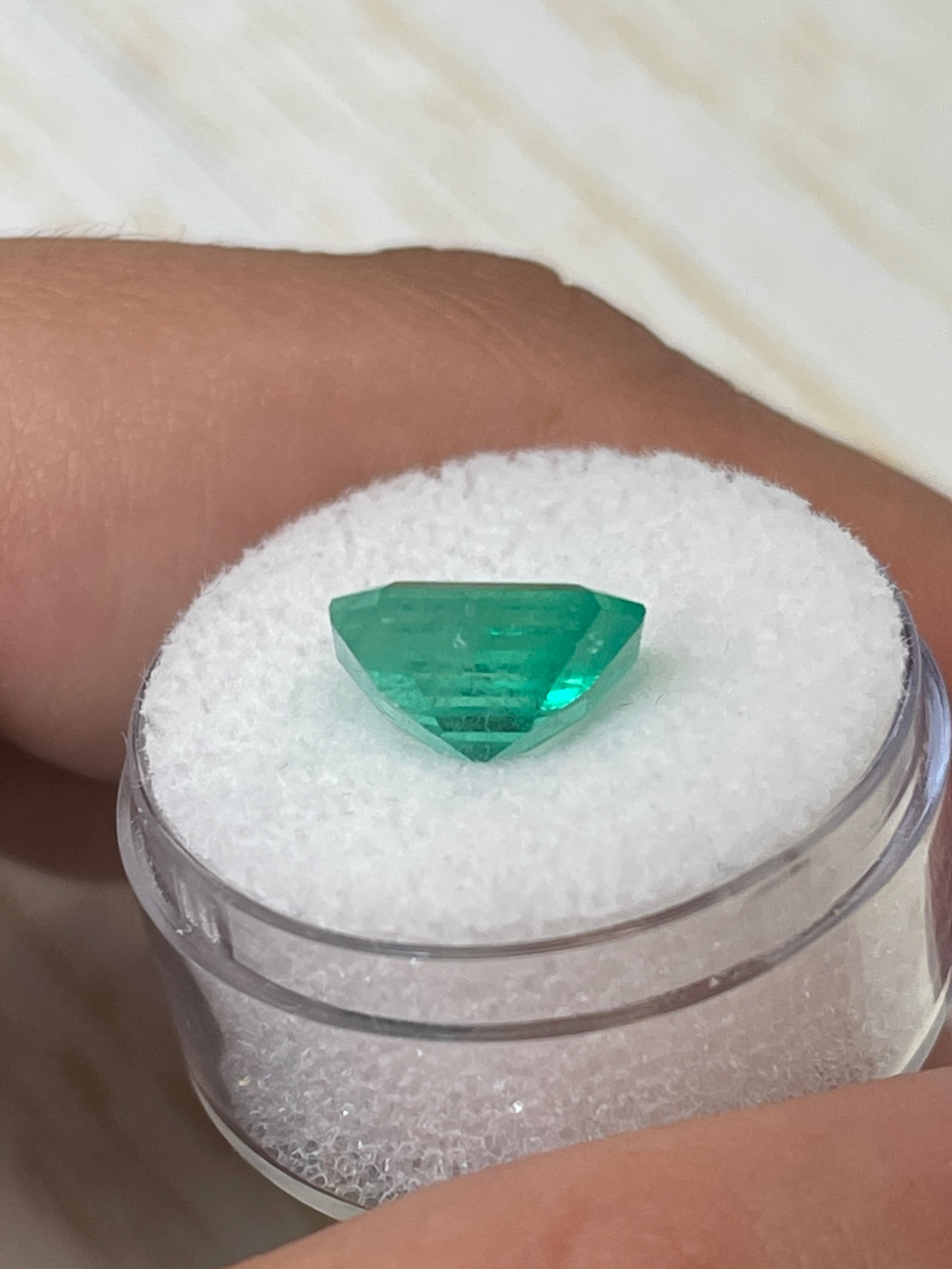 4.17 carat bluish green natural Colombian emerald loose gemstone in classic emerald cut, displayed by JR Colombian Emeralds