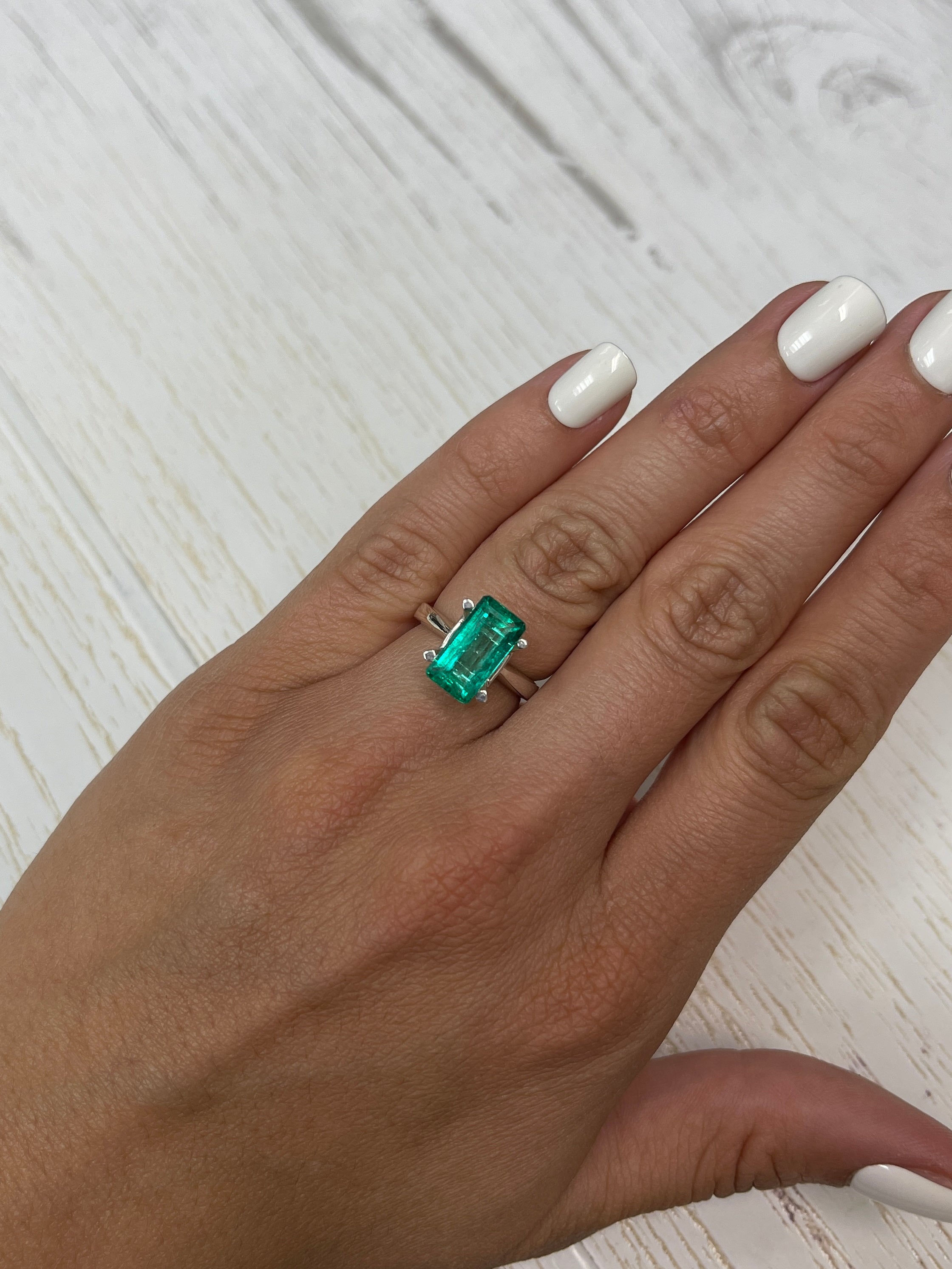 Vivid bluish green 4.26 carat natural Colombian emerald loose with elongated emerald cut, from JR Colombian Emeralds.