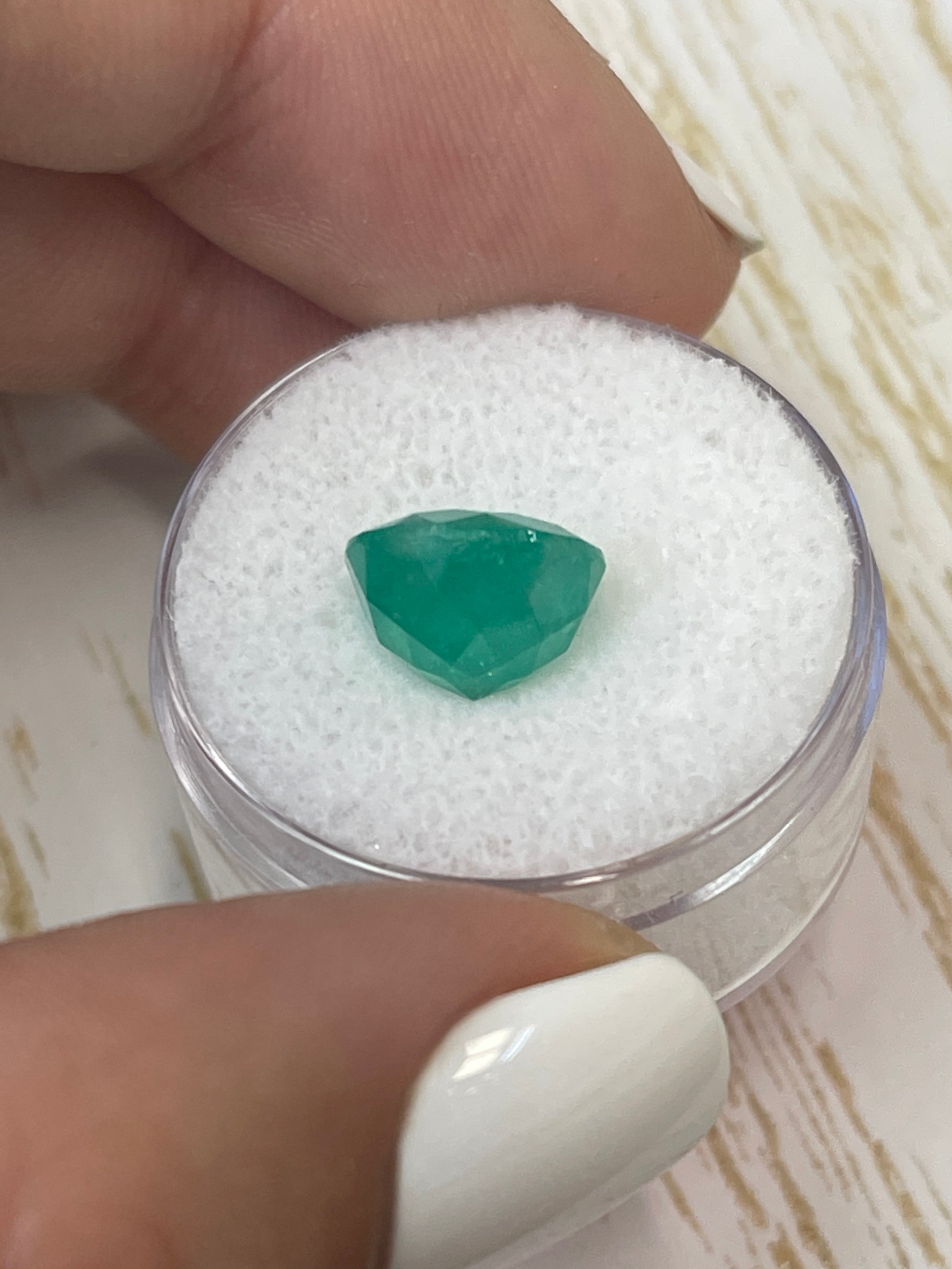 Medium green 4.42 carat round Colombian emerald loose gemstone from JR Colombian Emeralds, natural and vibrant in appearance.