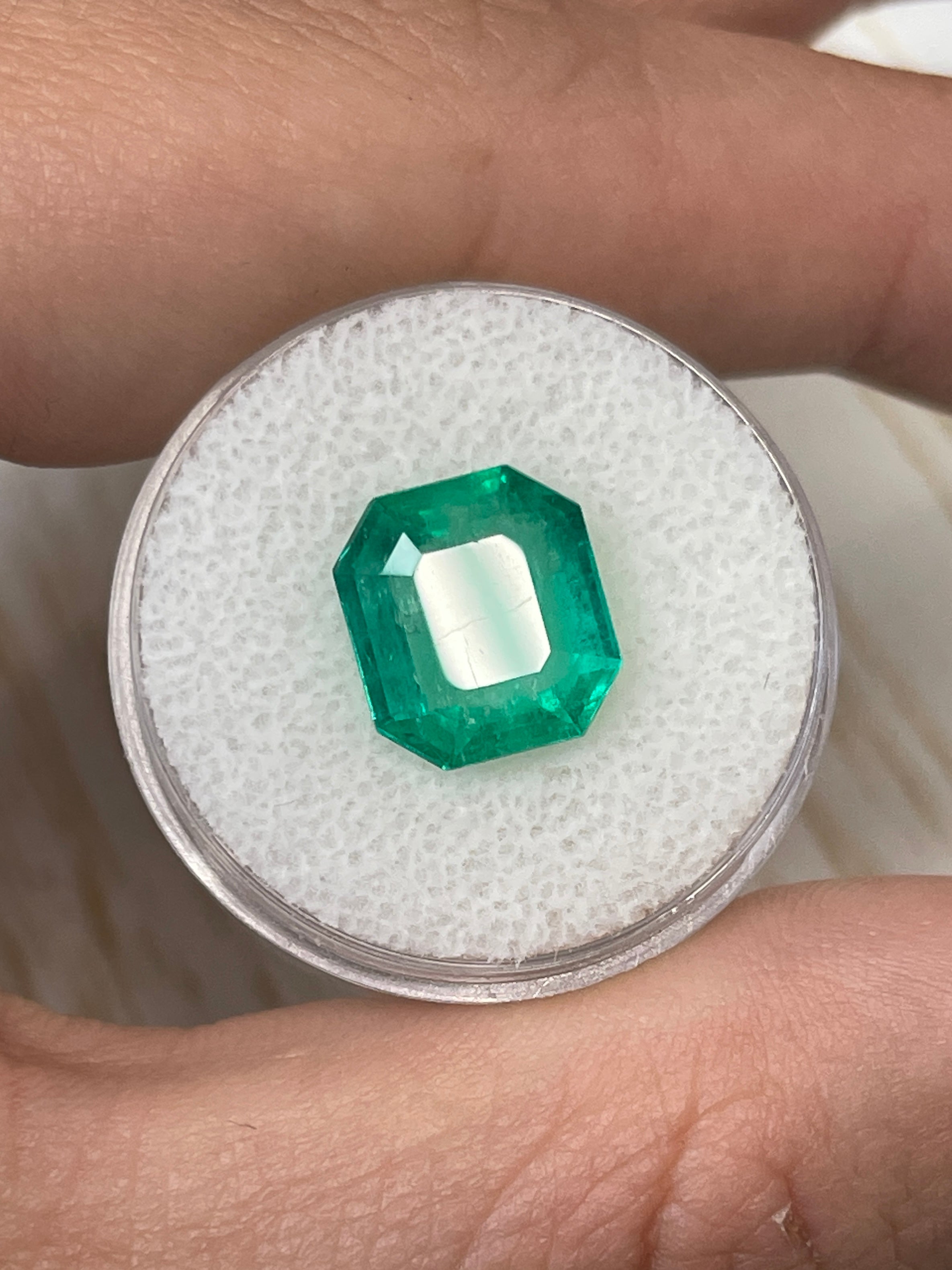 Natural 4.56 carat Colombian emerald loose gemstone, 11x10 mm emerald cut, from JR Colombian Emeralds, showcasing vibrant green color.