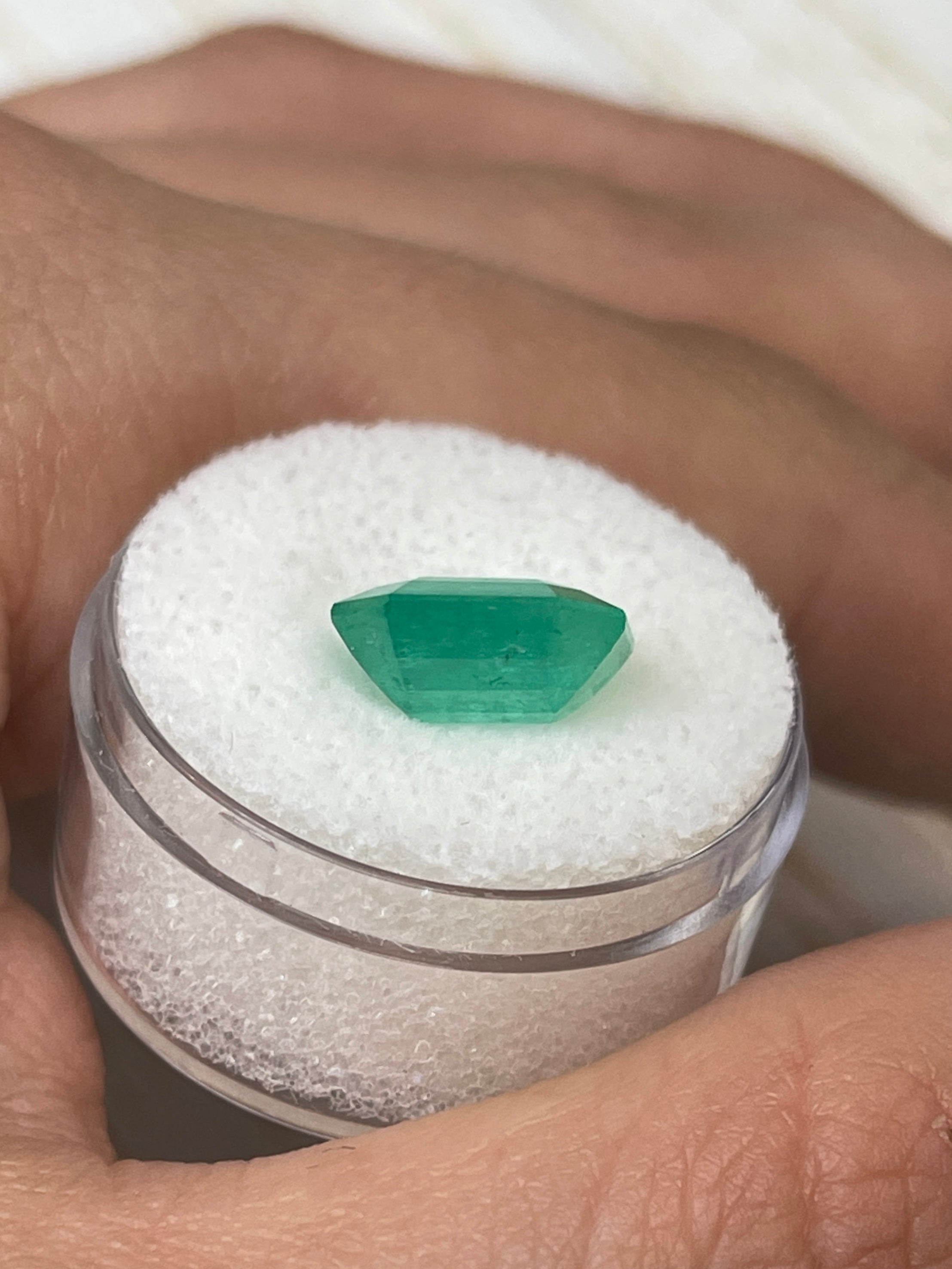 Natural loose Colombian emerald, 4.56 carats, 11x10mm, emerald cut, from JR Colombian Emeralds, showcasing vibrant green color and clarity.