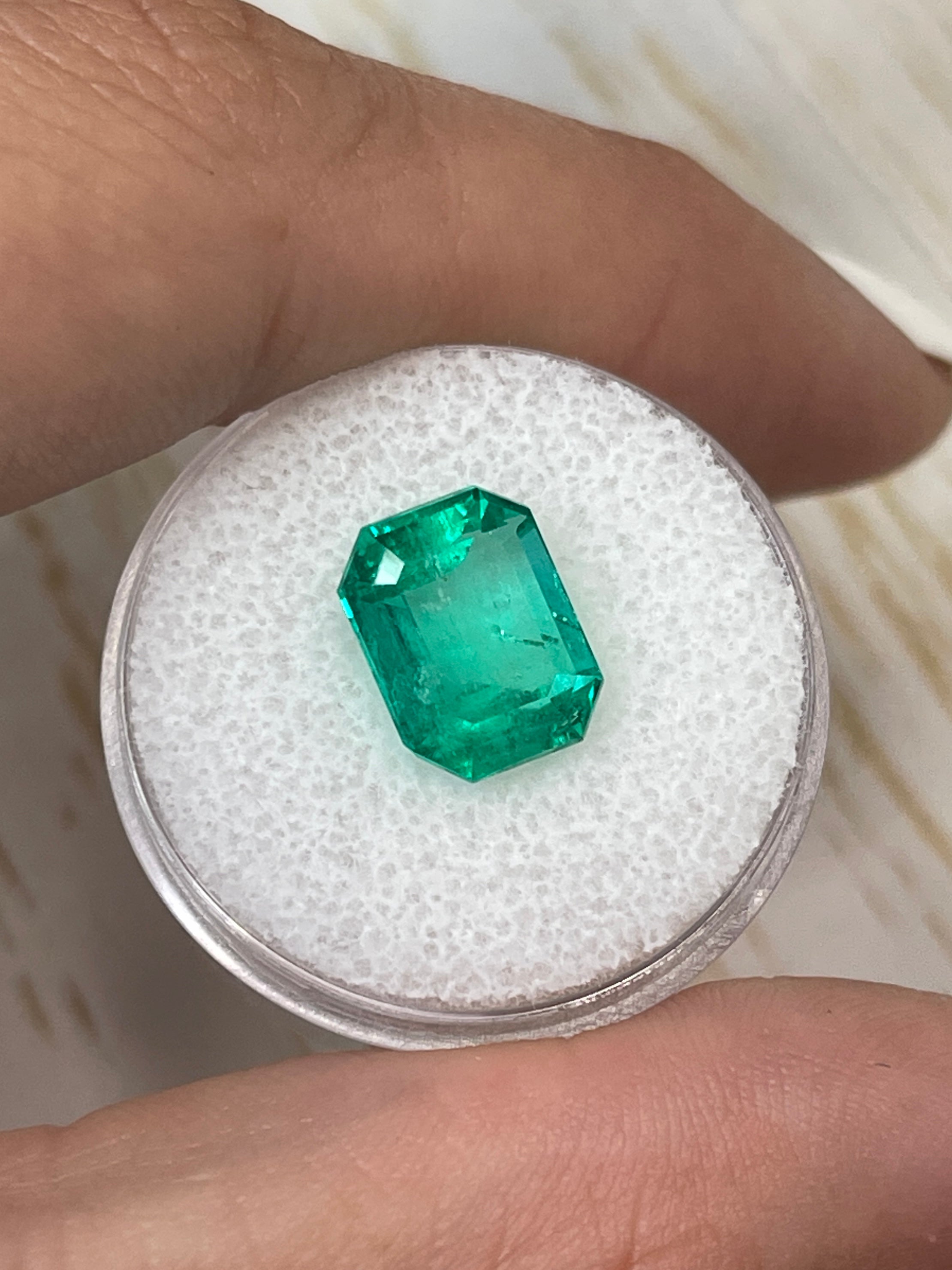 Loose 4.64 carat Colombian emerald with bluish-green hue in an emerald cut, natural and vibrant, from JR Colombian Emeralds.