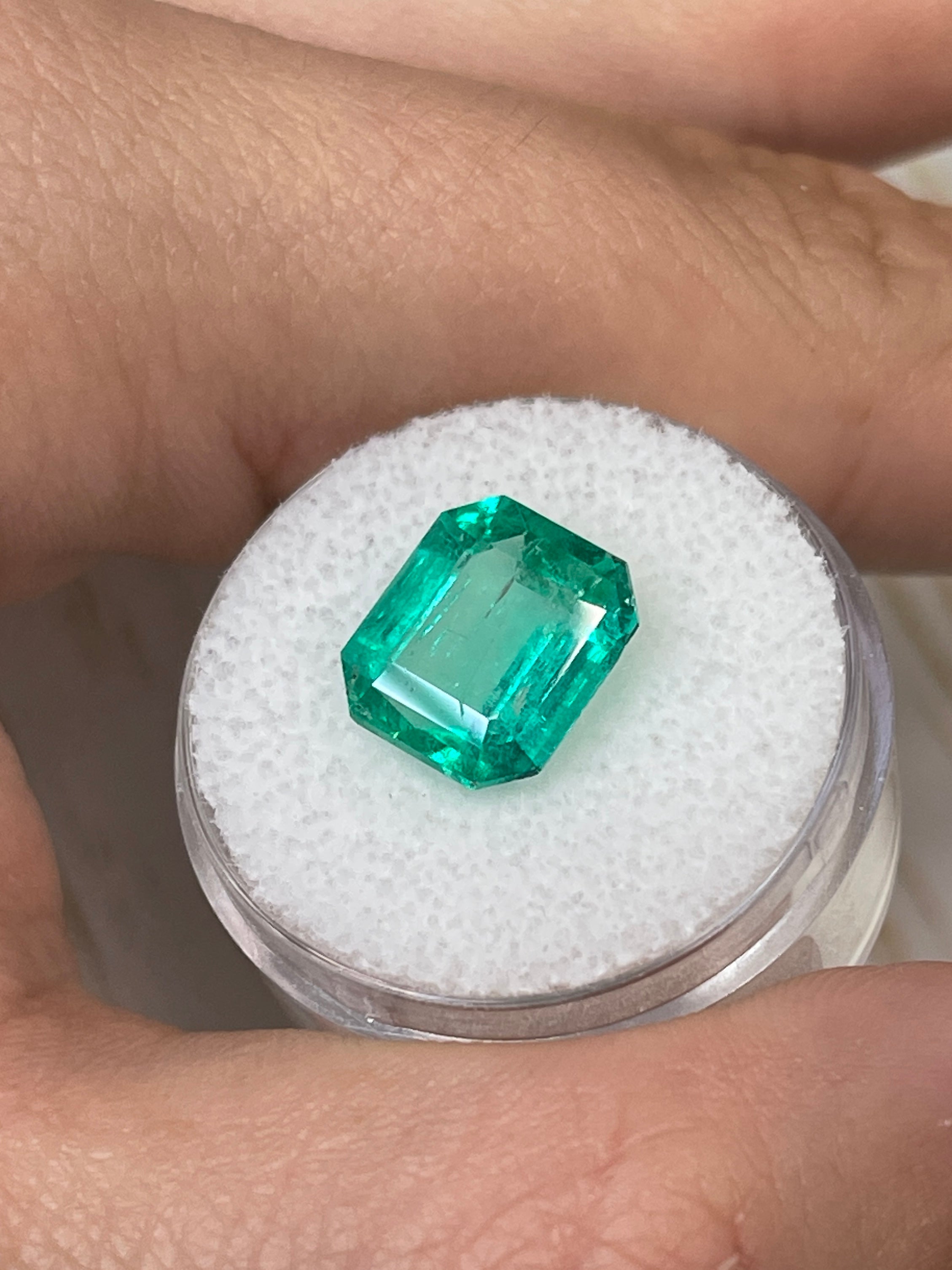 Natural 4.72 carat bluish Colombian emerald loose Asscher cut, 11x10mm, from JR Colombian Emeralds, showcasing vibrant color and clarity.