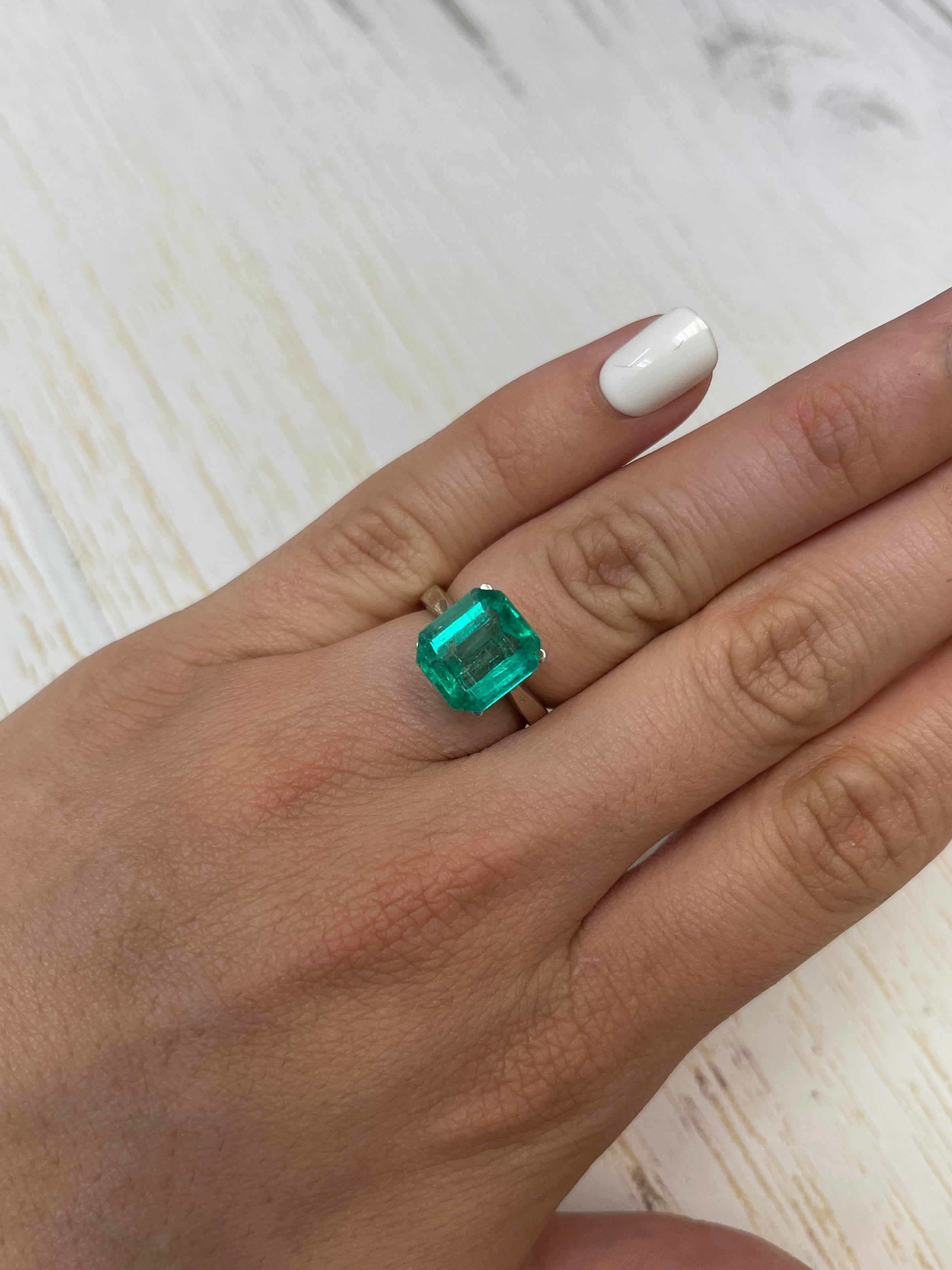 Loose 4.72 carat bluish Colombian emerald in an 11x10 Asscher cut, natural and vibrant, from JR Colombian Emeralds.