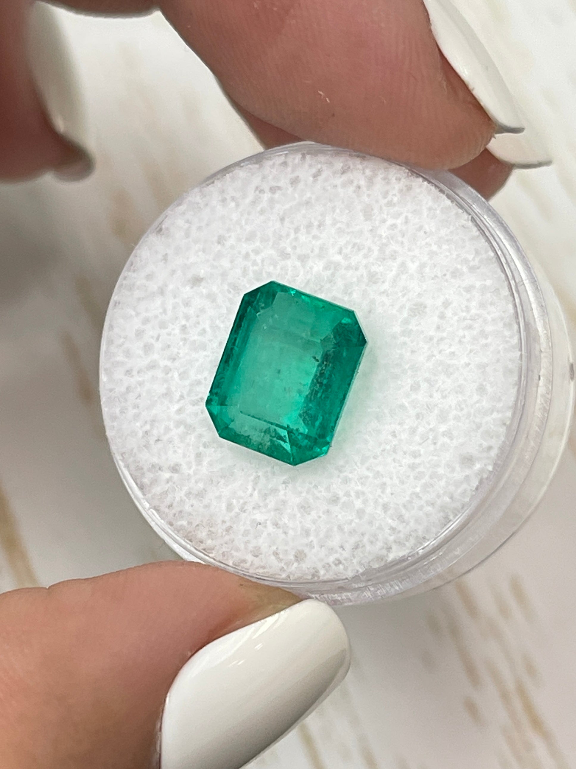 Natural 5.11 carat 10x8 green Colombian emerald loose gemstone in emerald cut by JR Colombian Emeralds.