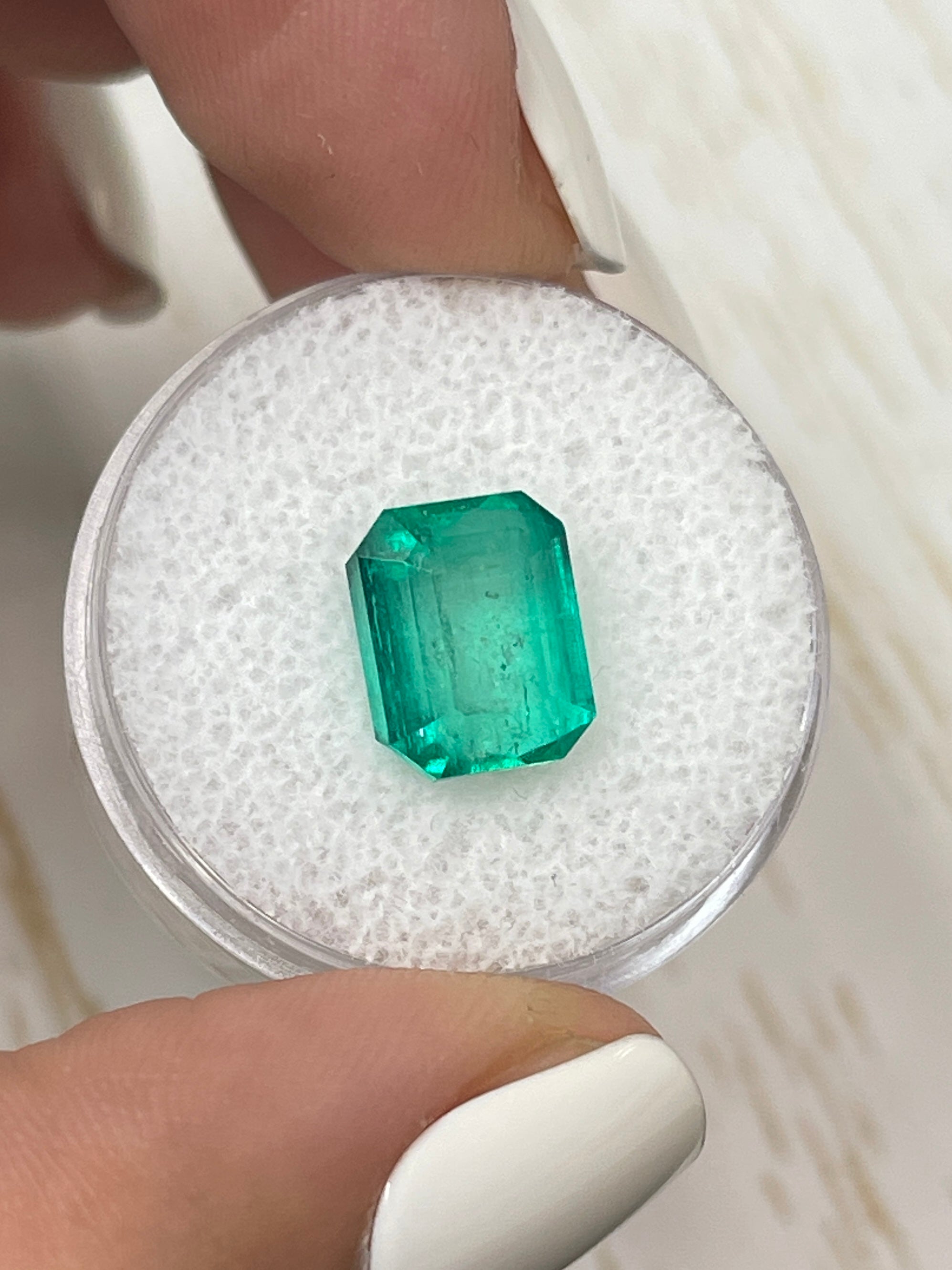 Natural 5.11 carat 10x8 green Colombian emerald loose gemstone in an emerald cut, from JR Colombian Emeralds.